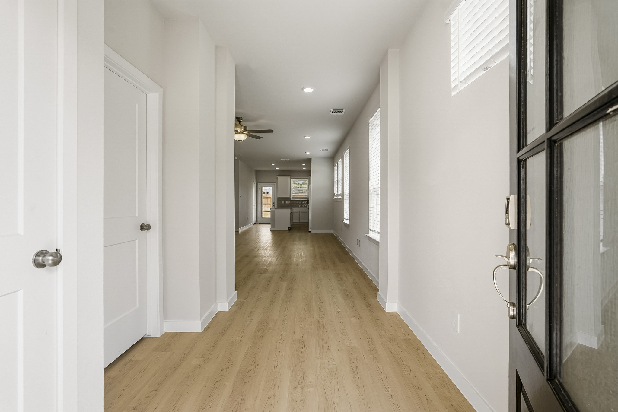 A hallway with white doors.