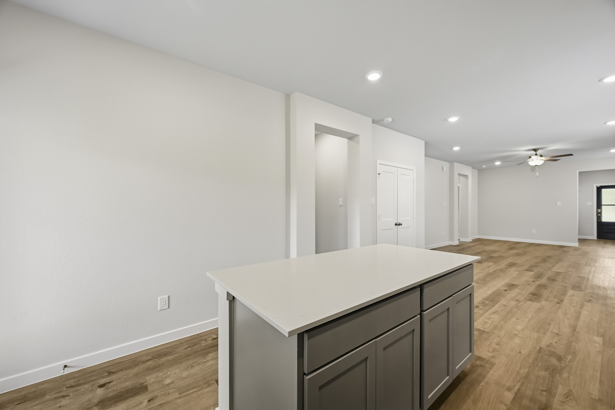 A room with a table and cabinets.