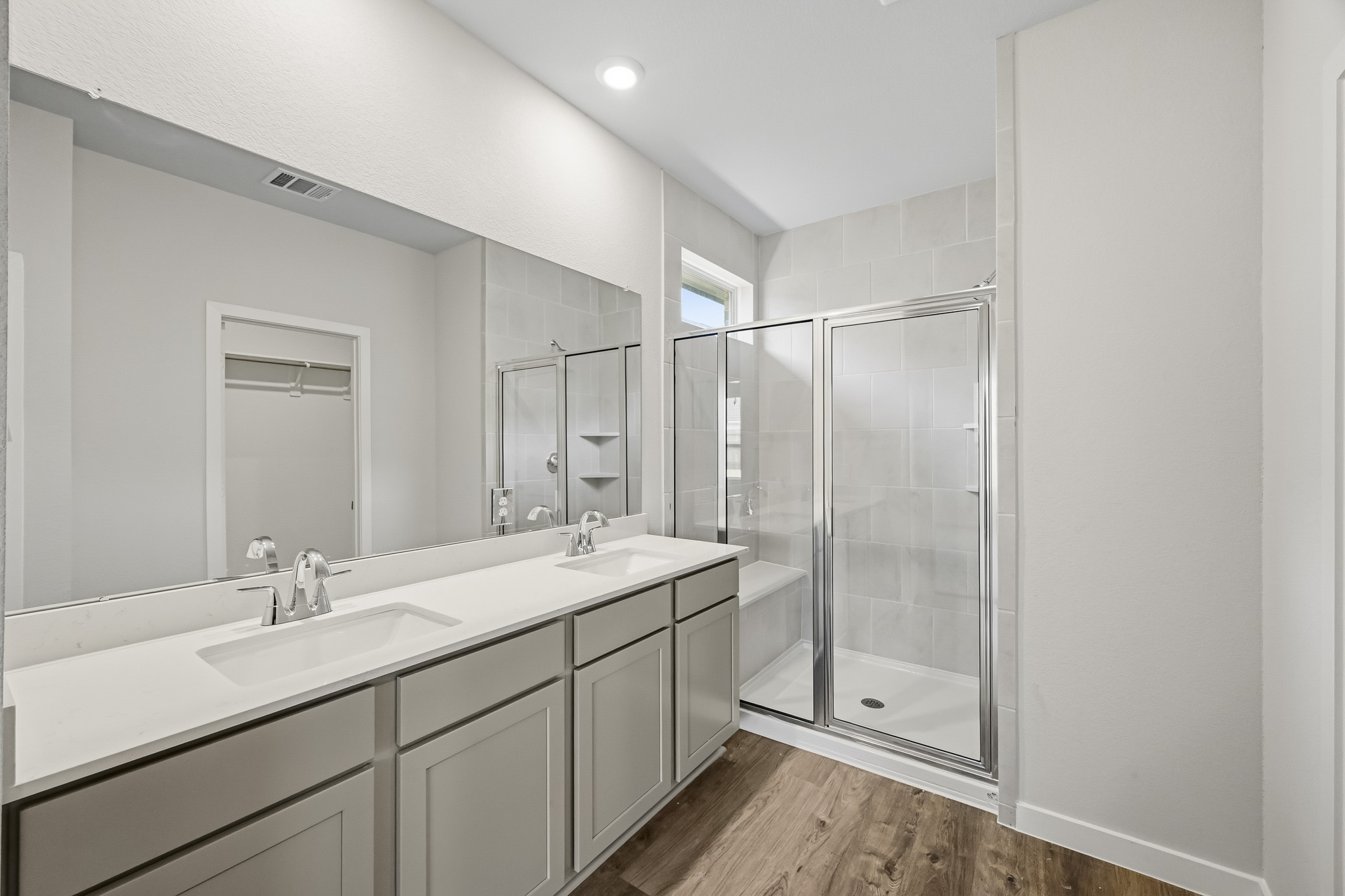 A bathroom with a glass shower.