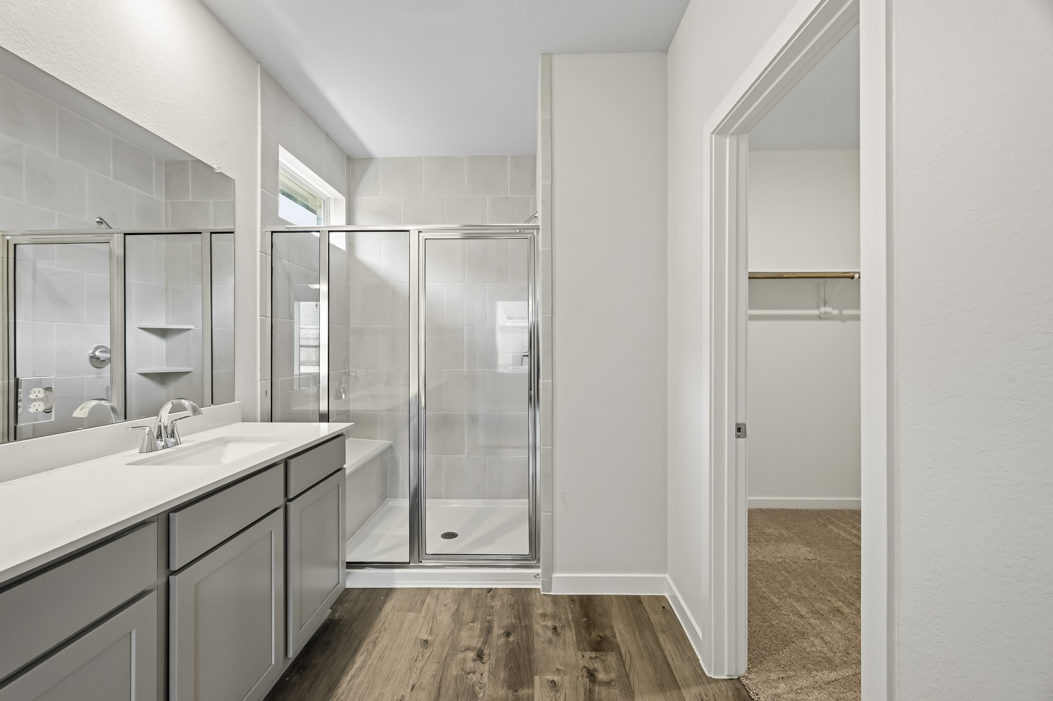 A bathroom with a glass shower.