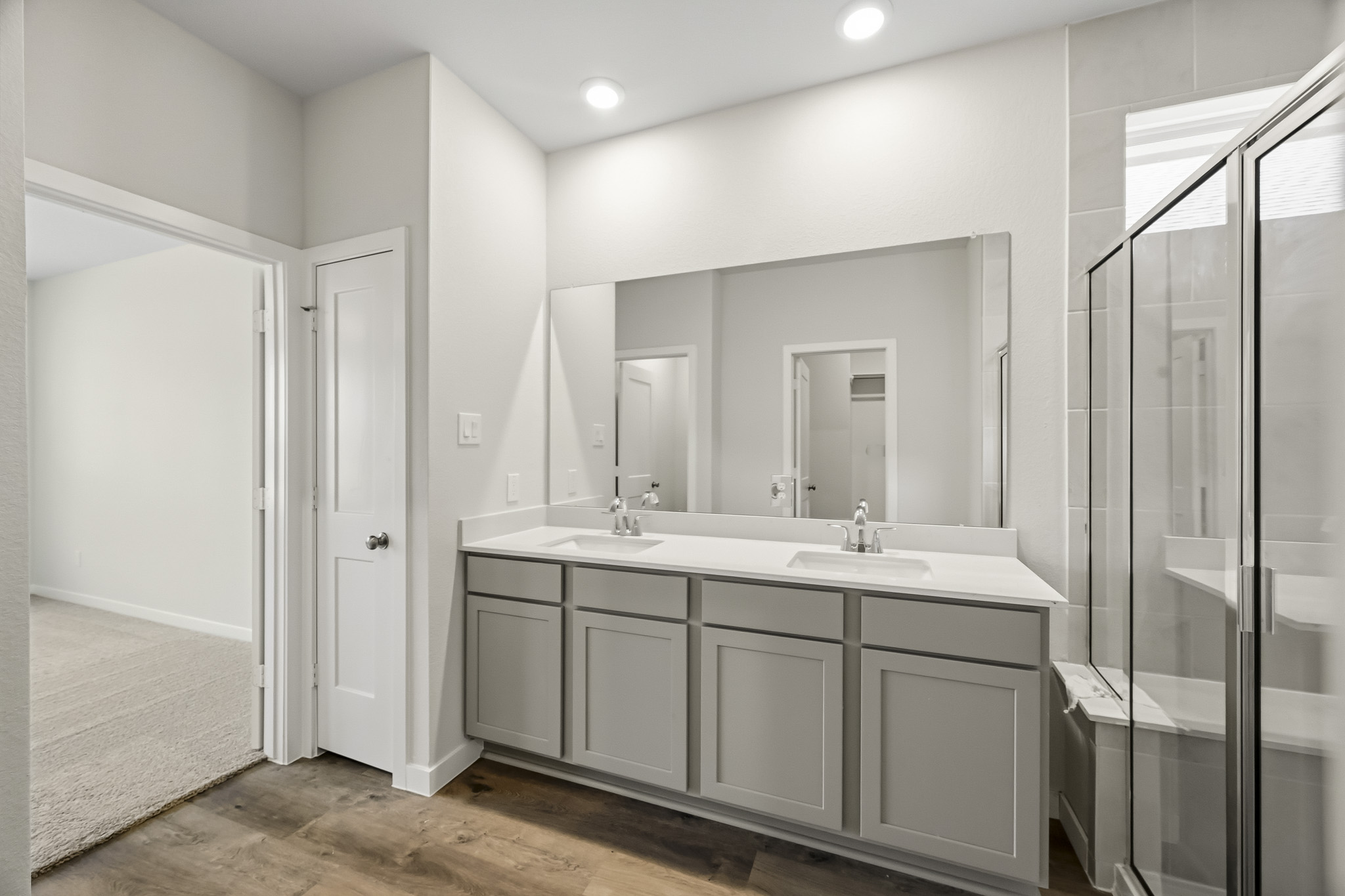 A bathroom with a glass shower.