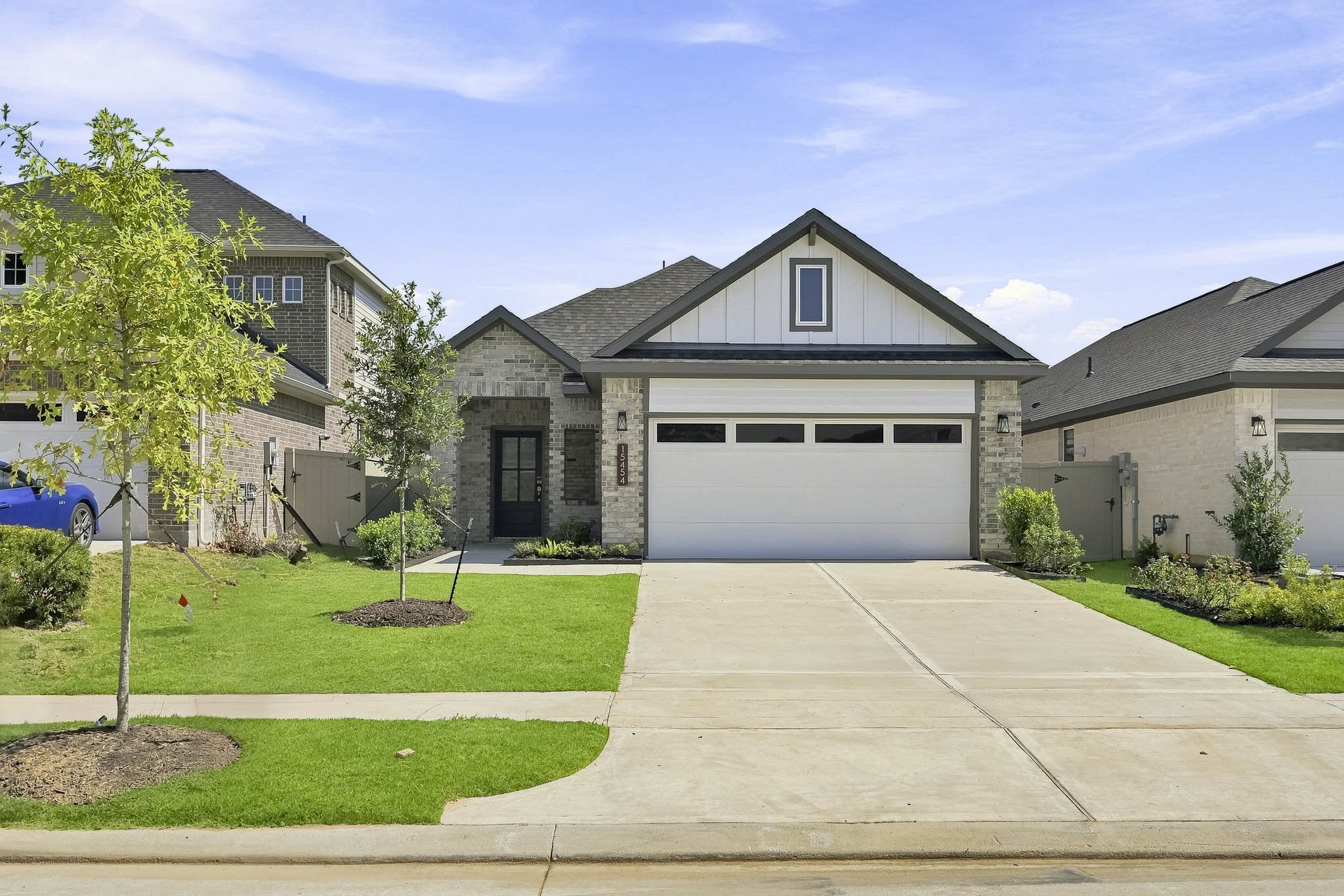 A driveway leading to a house.