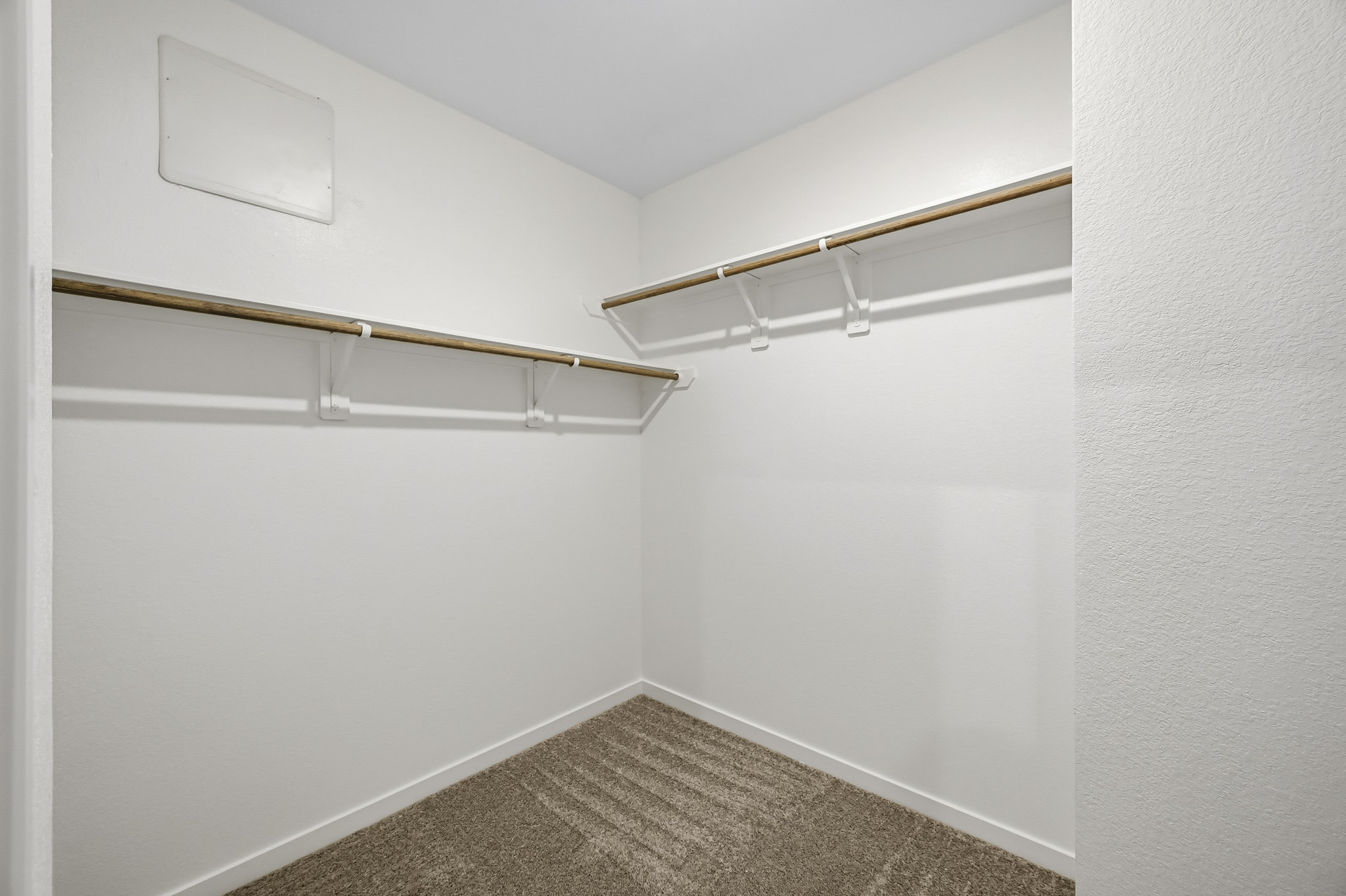 A hallway with white walls.