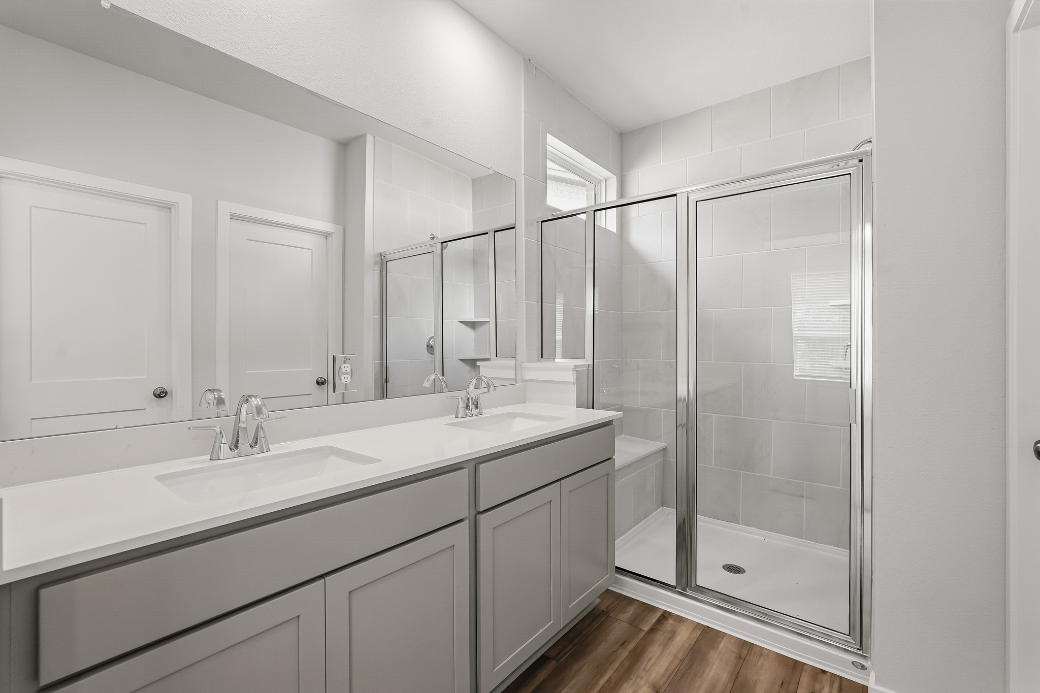 A bathroom with a glass shower.