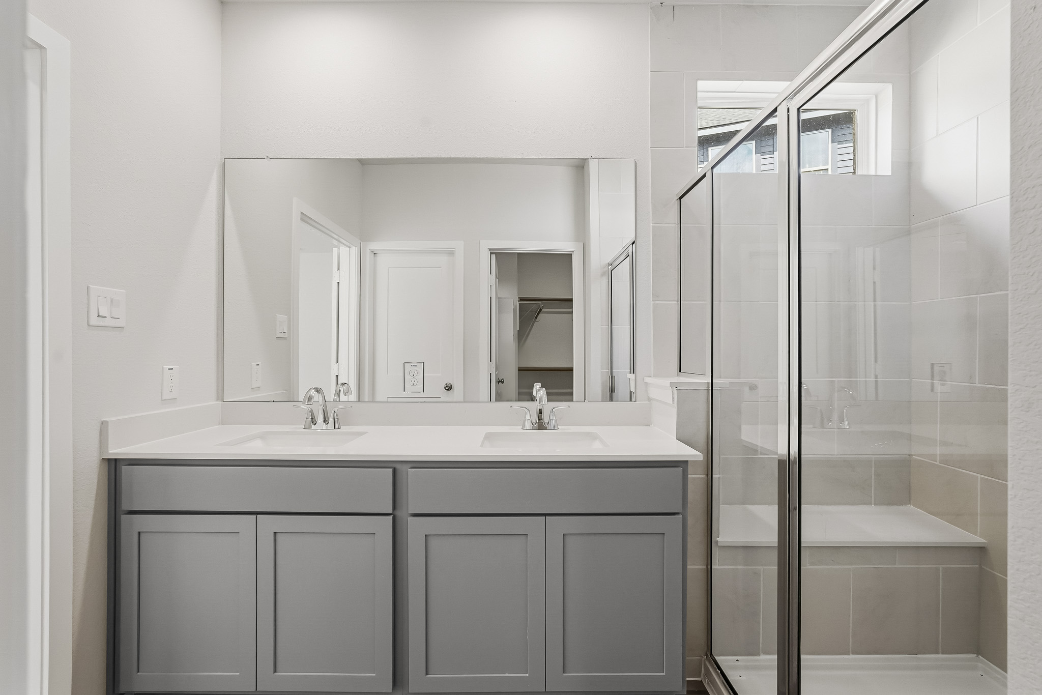 A bathroom with a glass shower.