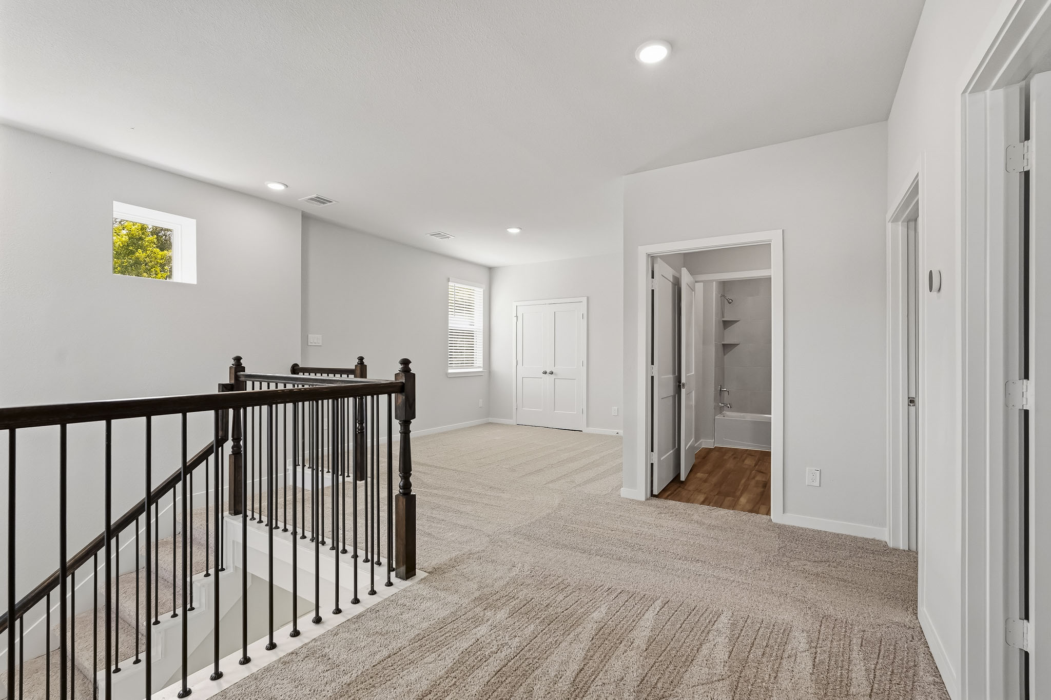 A hallway with white walls.