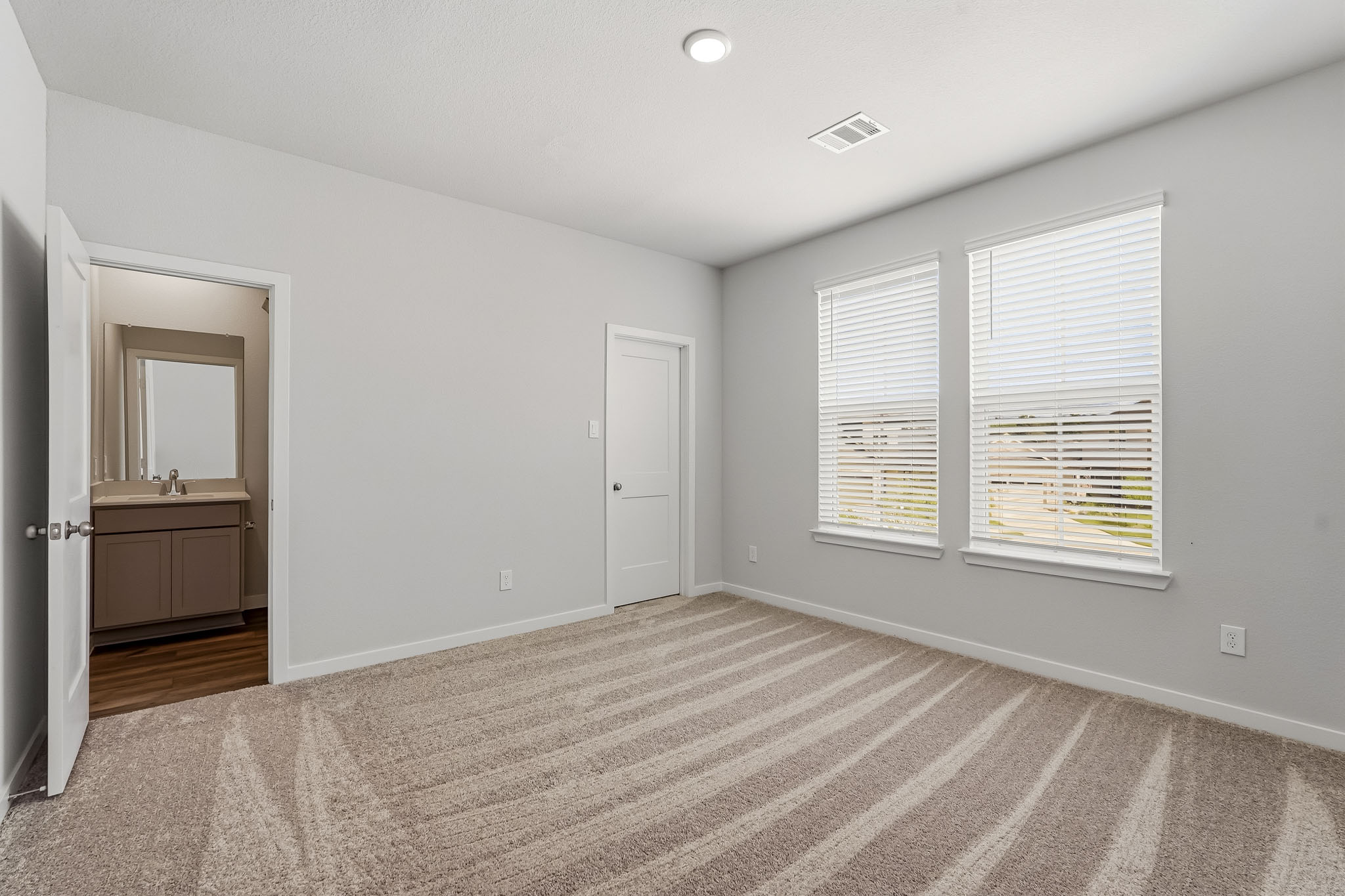 A room with a door and a window.