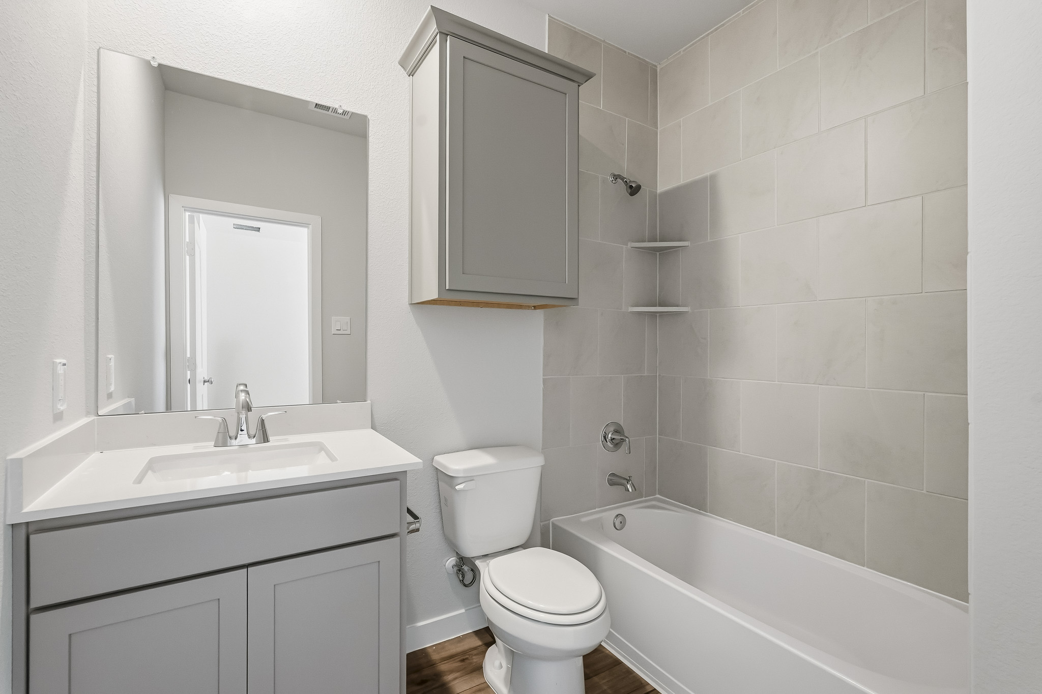 A bathroom with a toilet and sink.