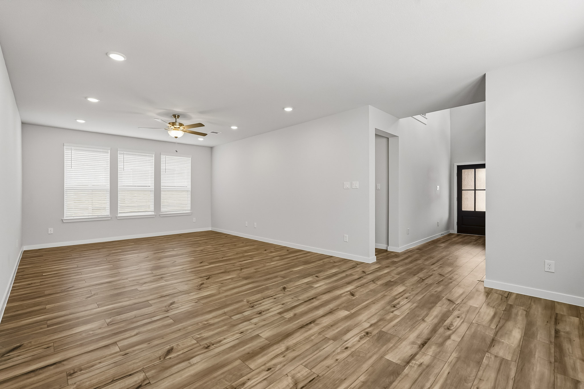 A room with a wood floor and a wood floor.