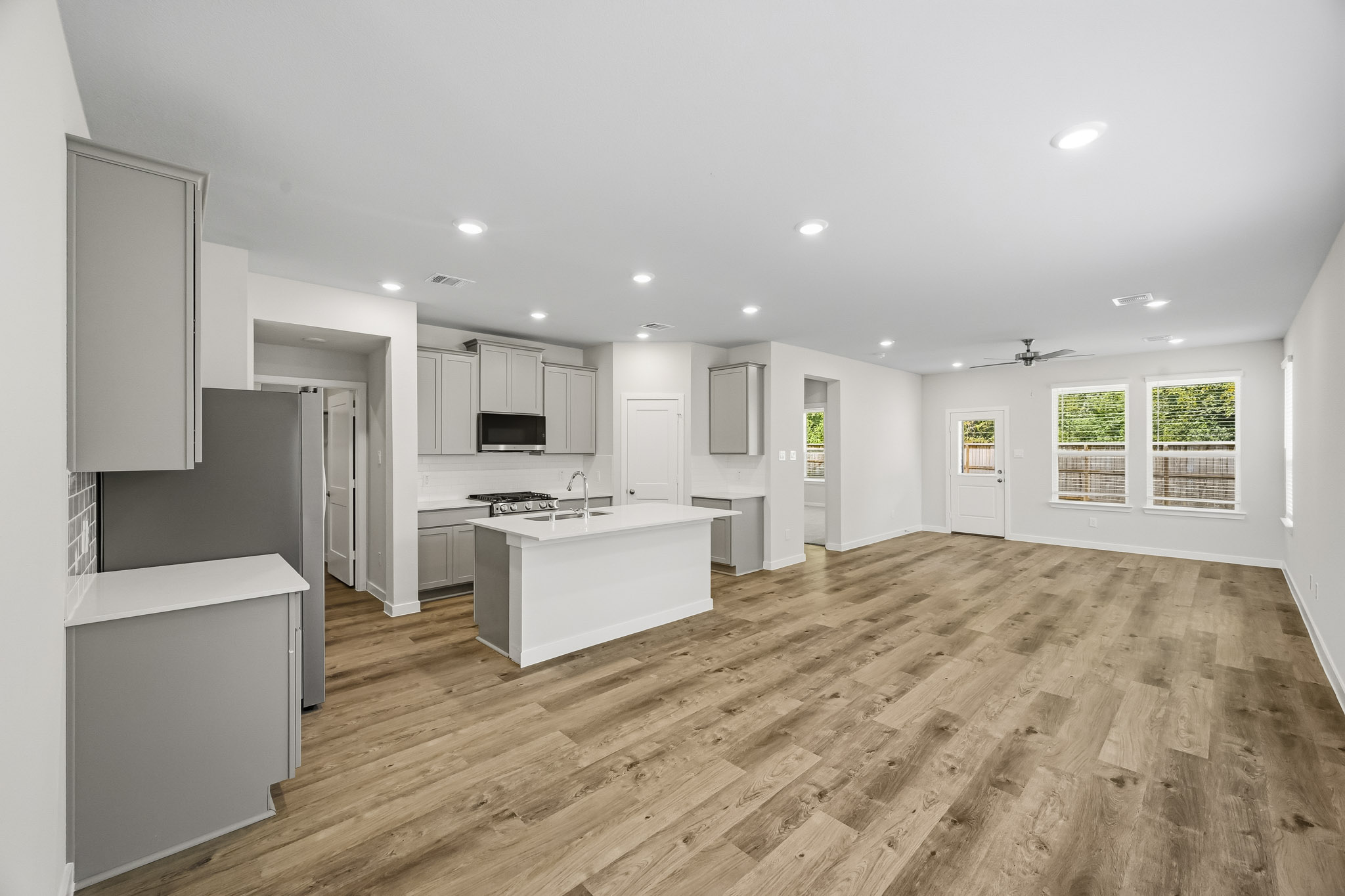 A large kitchen with white cabinets.