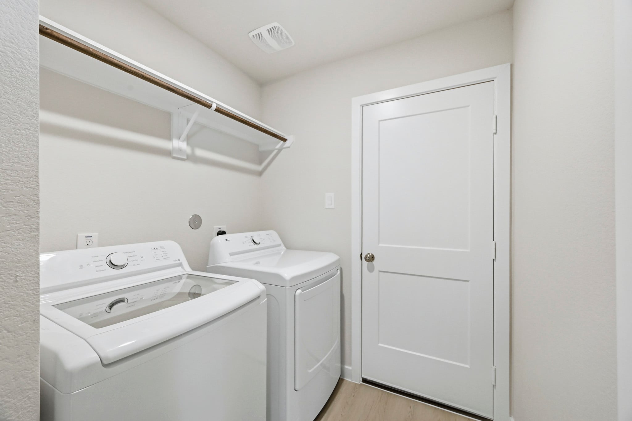 A washer and dryer in a room.