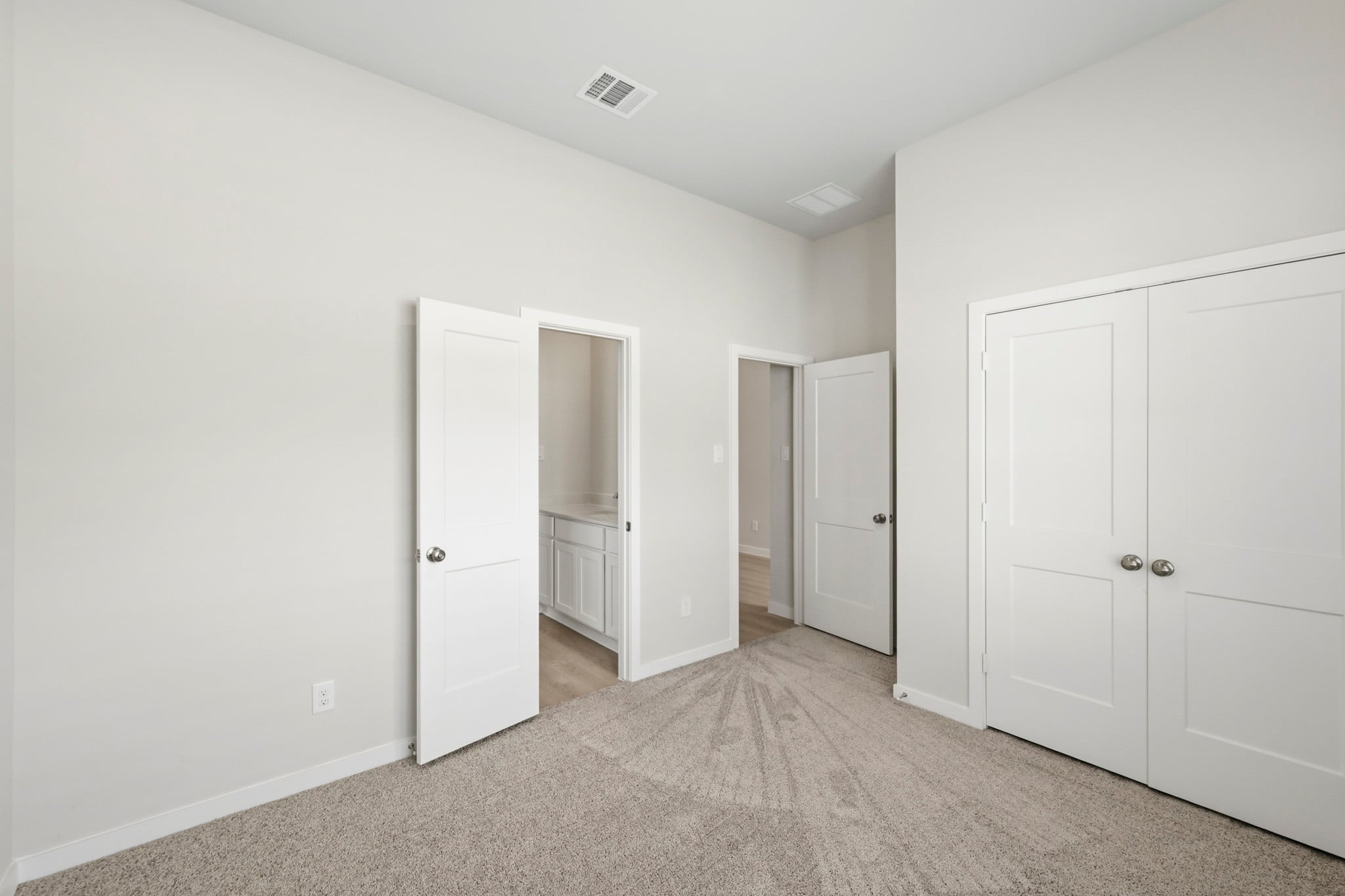 A room with white doors.