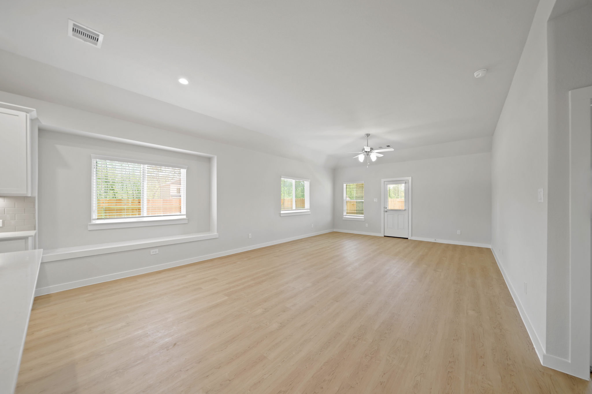 A room with a wood floor and a wood floor.