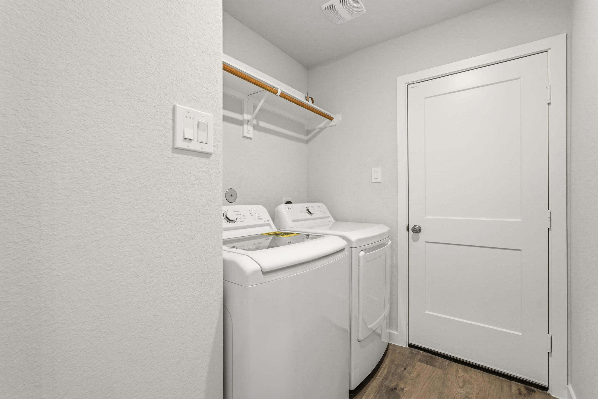 A washer and dryer in a room.