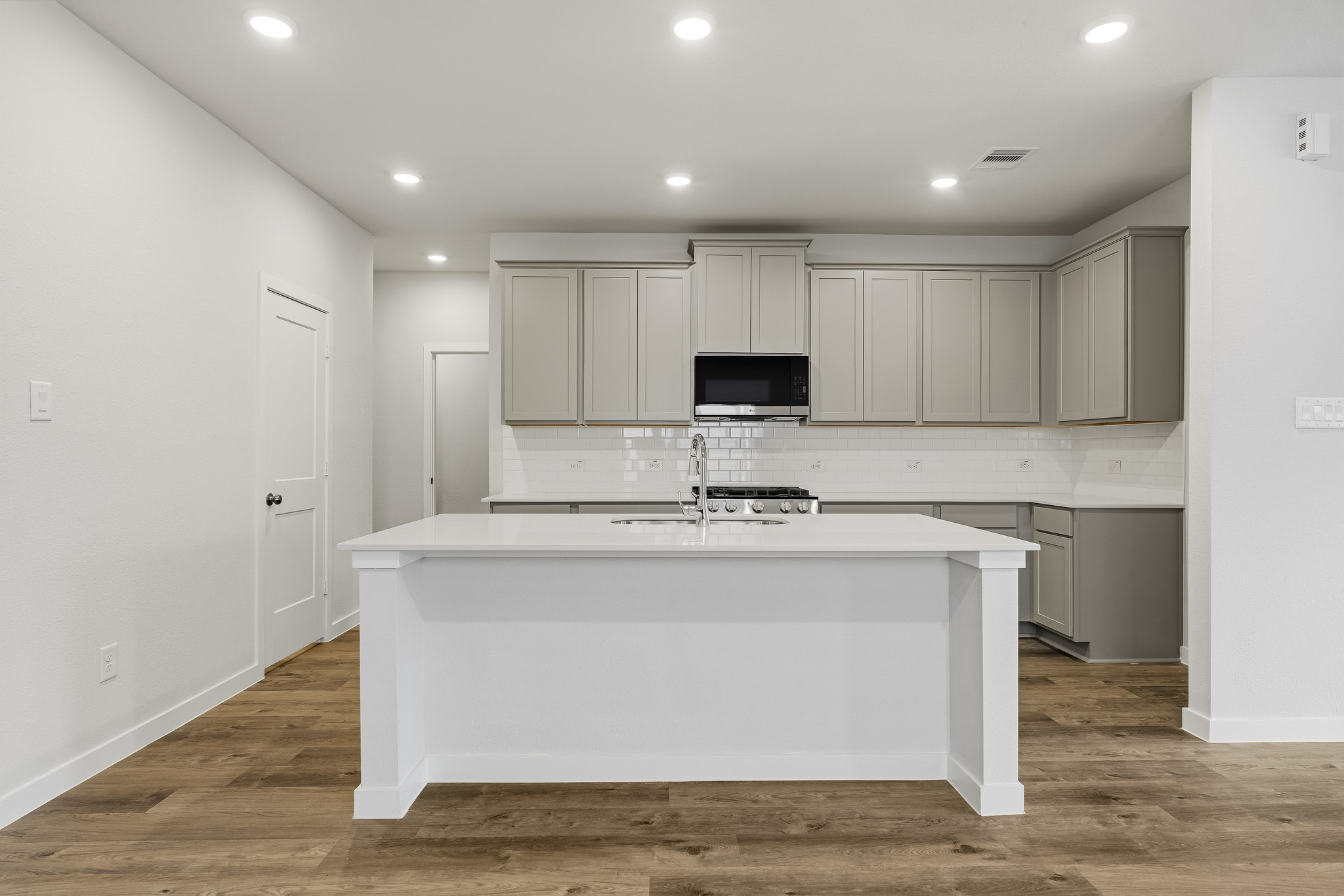 A white kitchen with white cabinets.