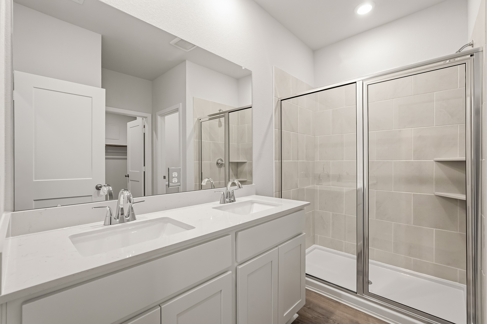 A bathroom with a glass shower.