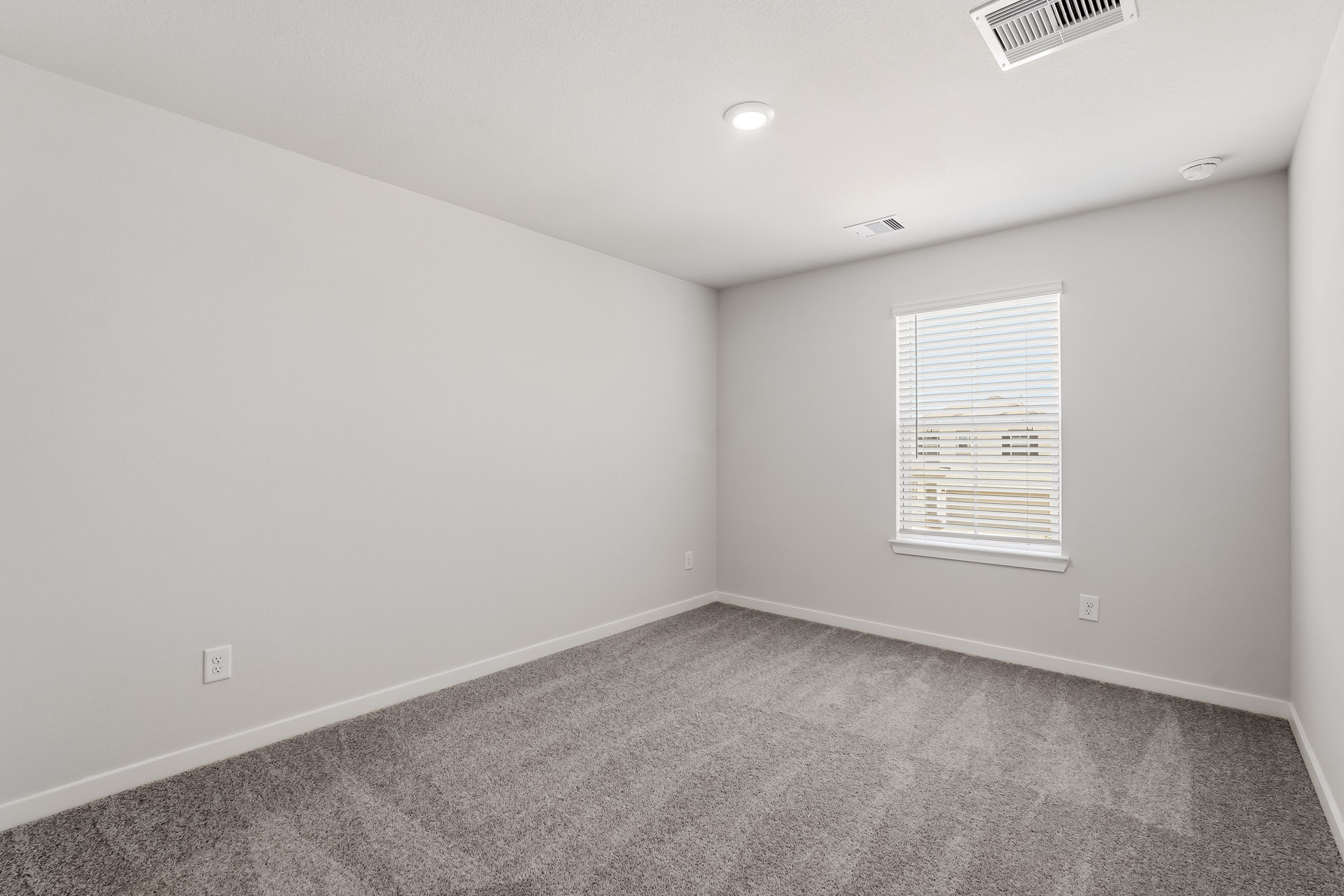 A room with a door and a window.