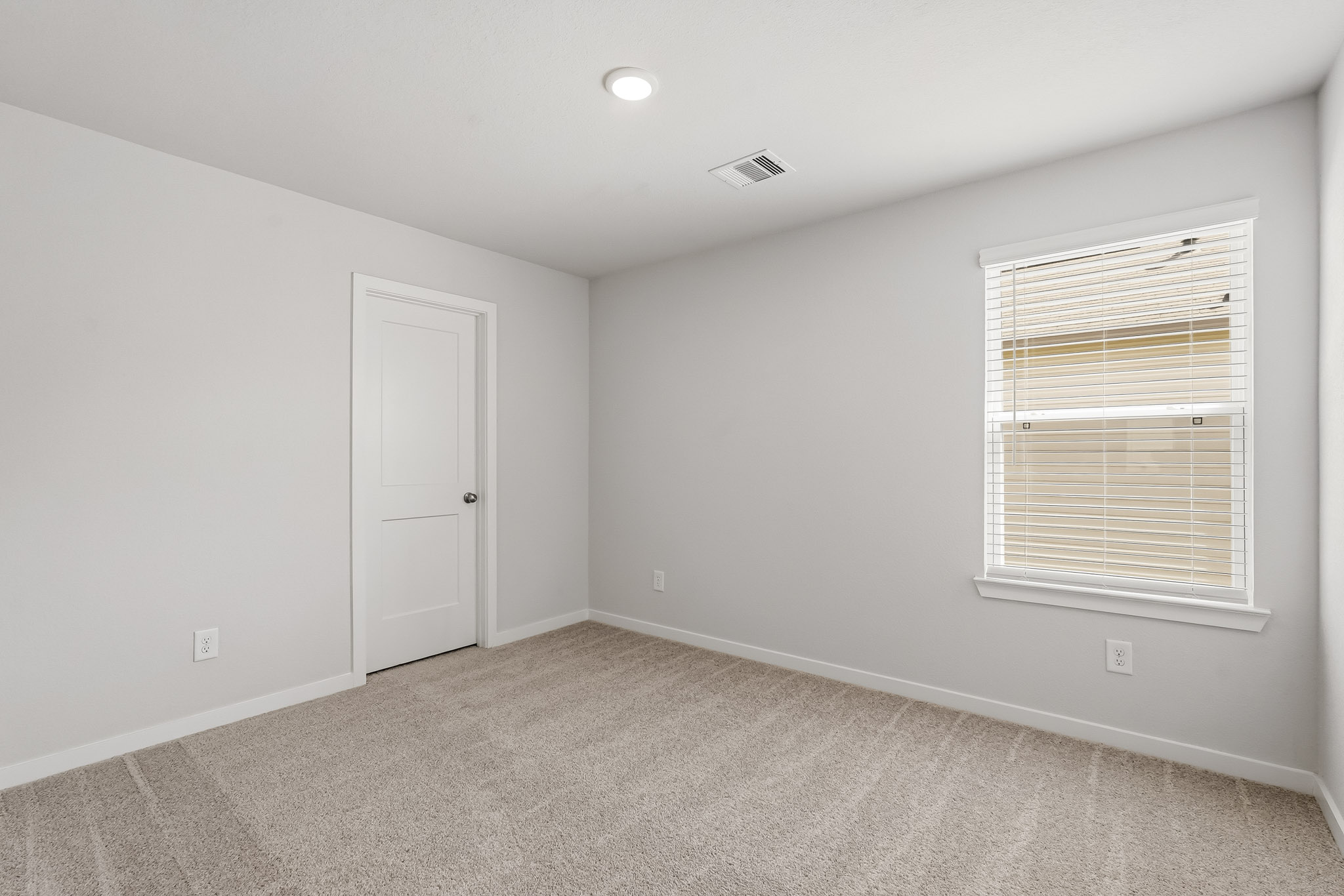 A room with a door and a window.