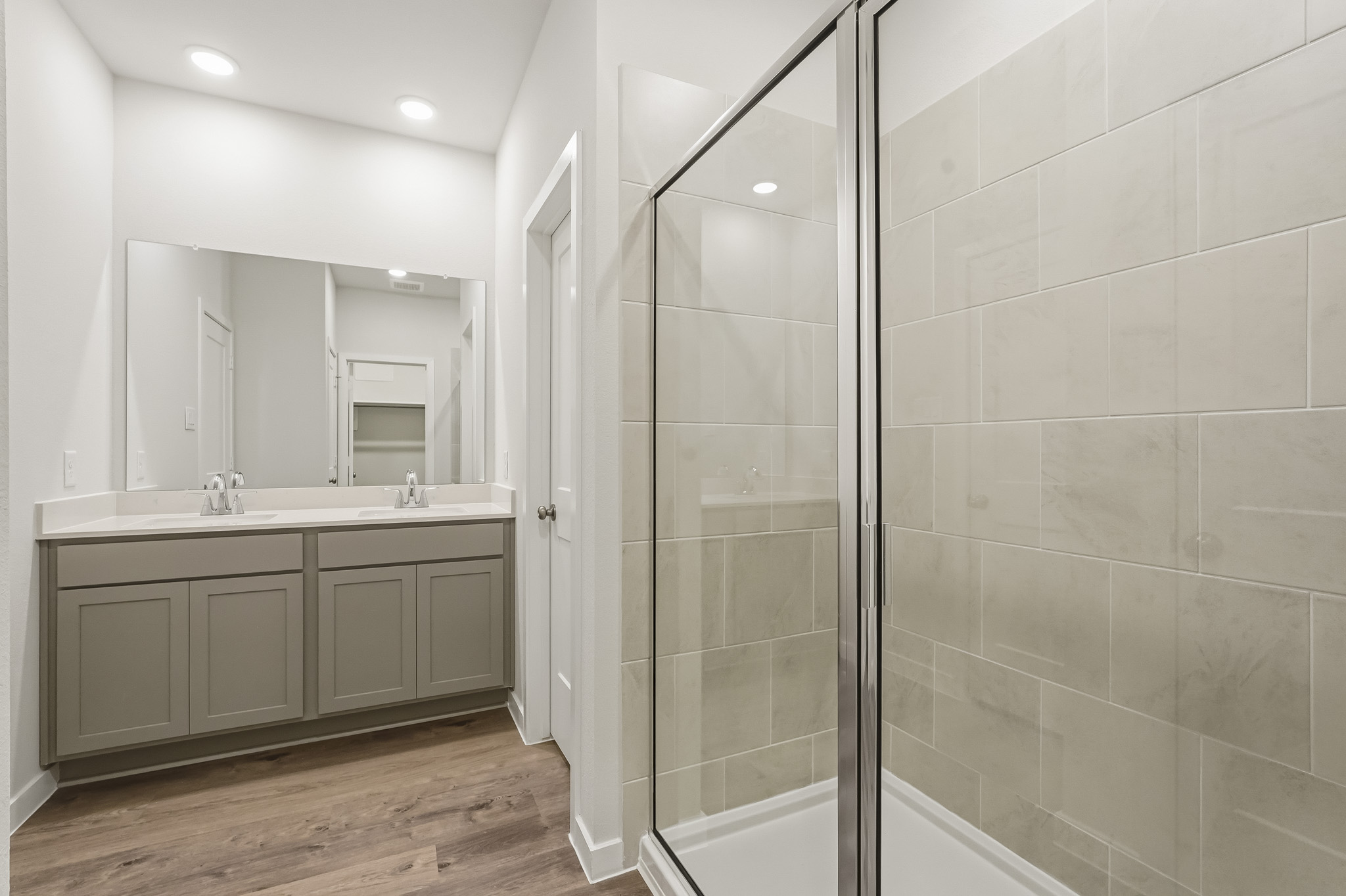 A bathroom with a glass shower.