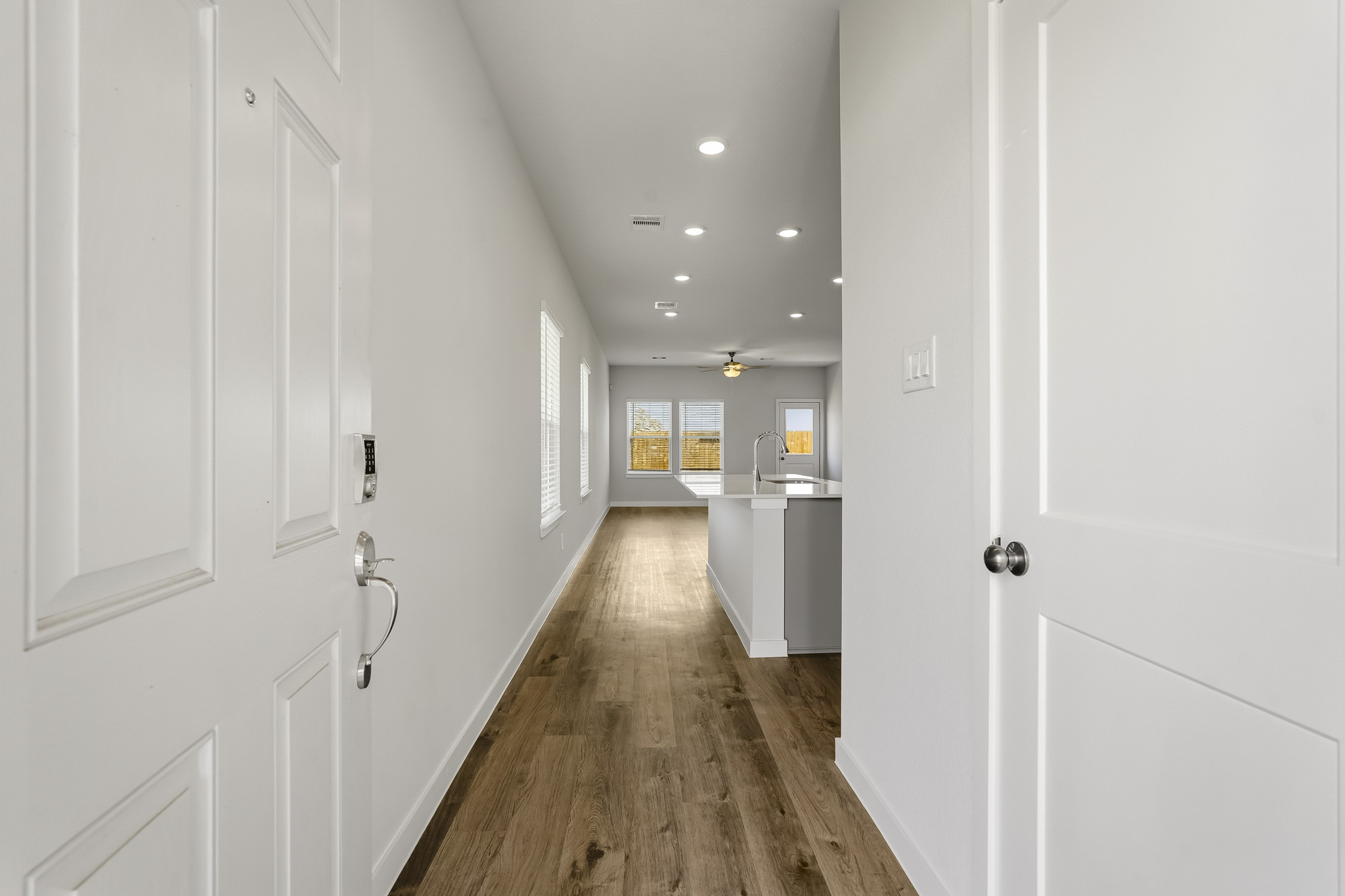 A hallway with white doors.
