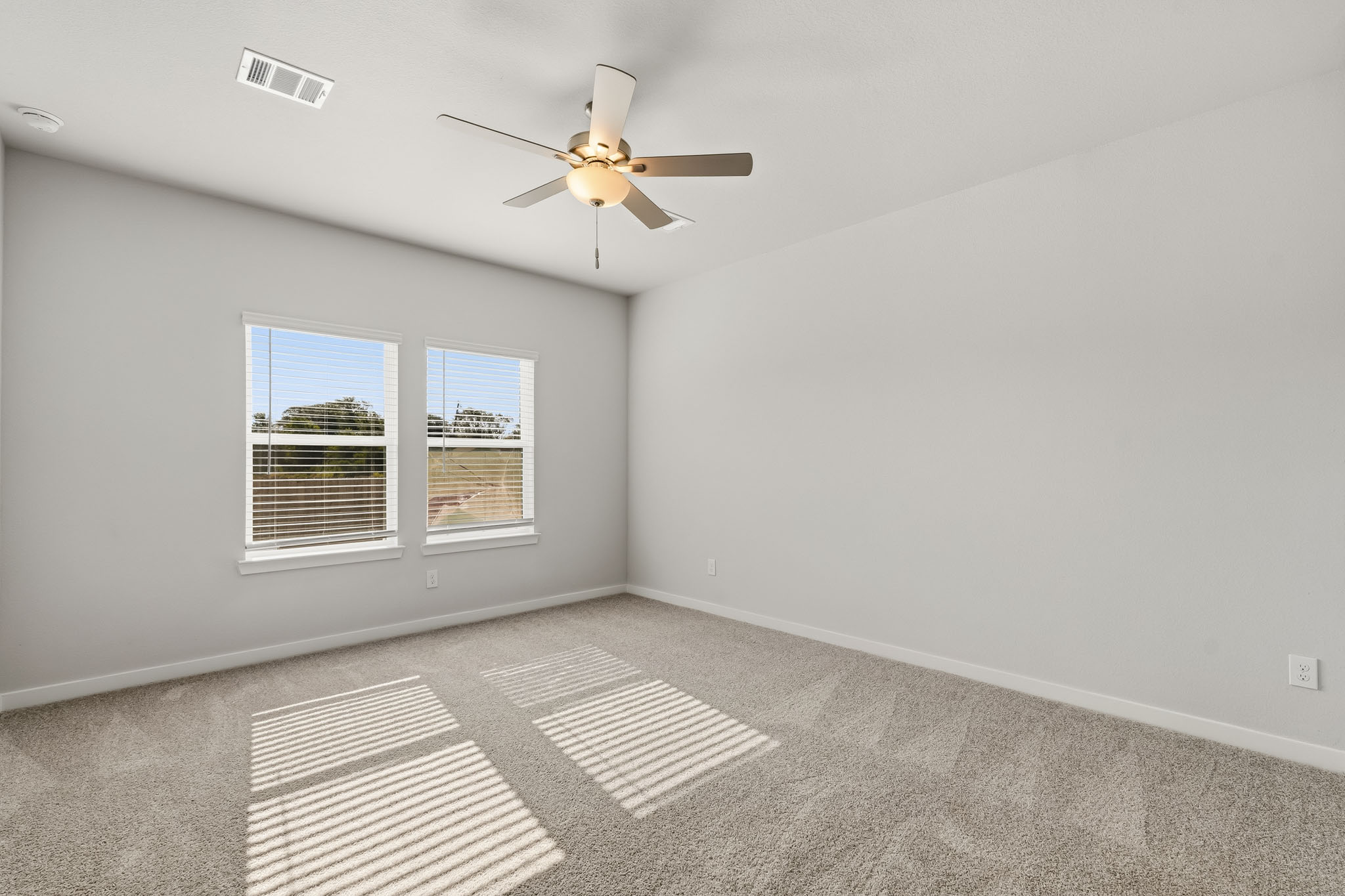 A ceiling fan in a room.