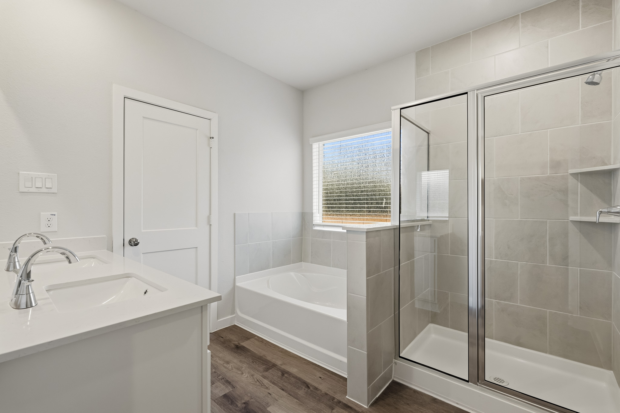 A bathroom with a glass shower.