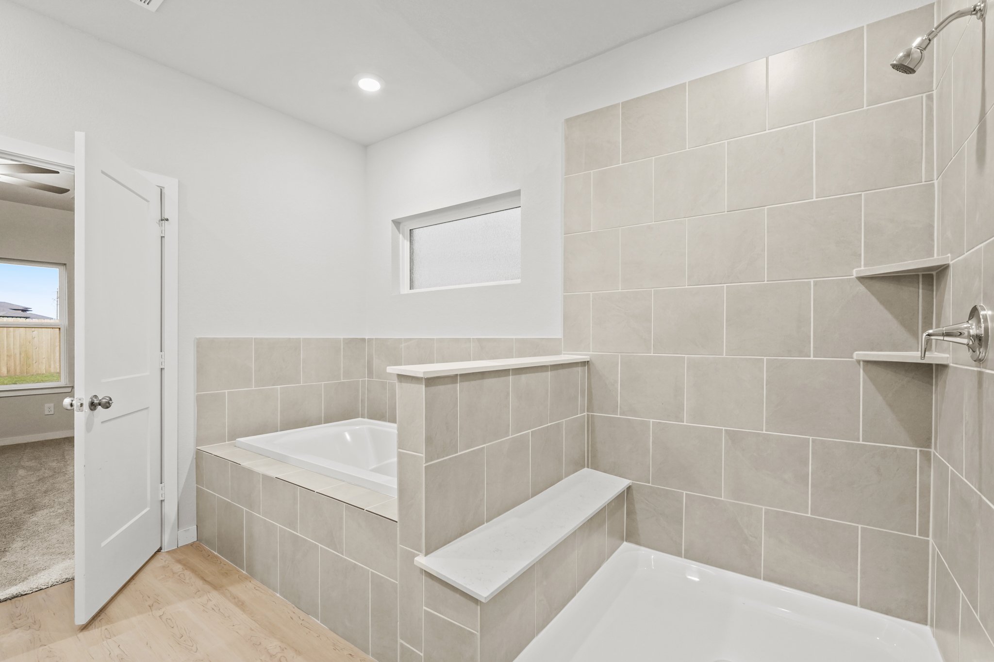 A bathroom with a tub and sink.