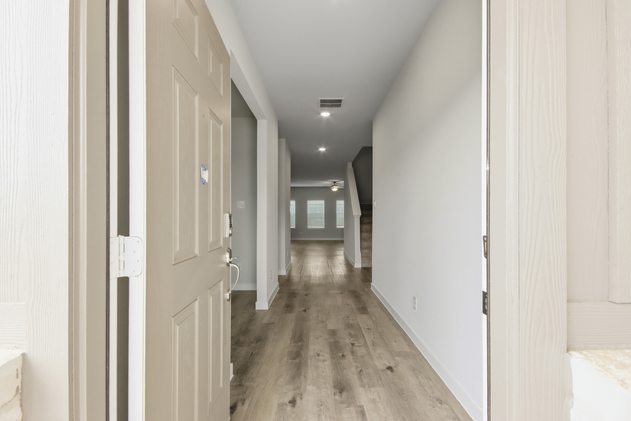 A hallway with white doors.