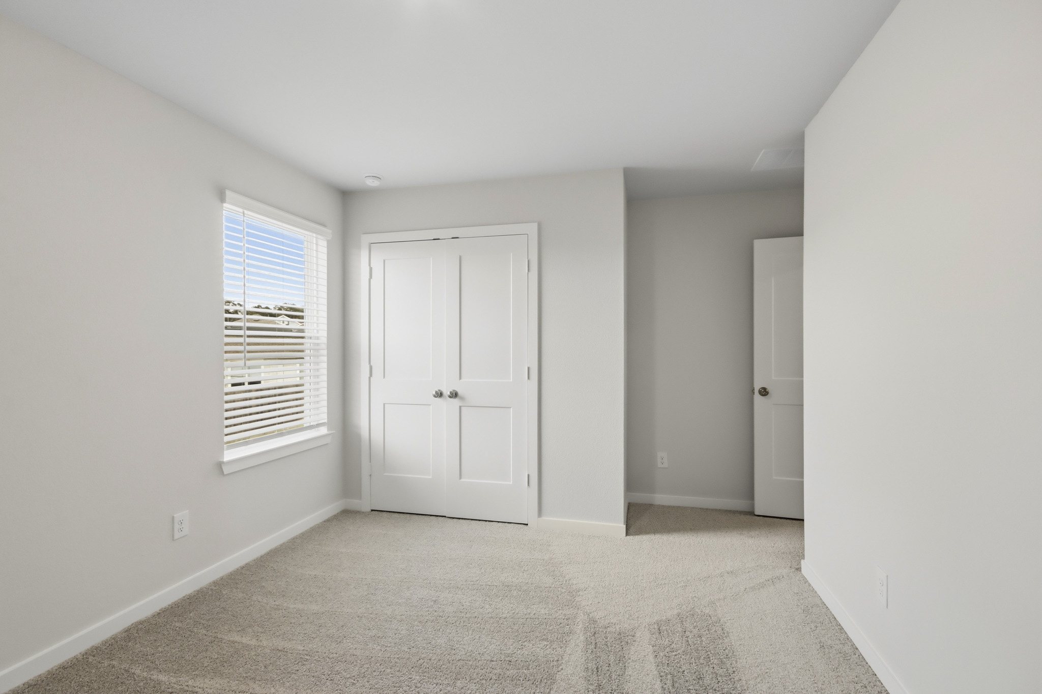 A room with white doors.