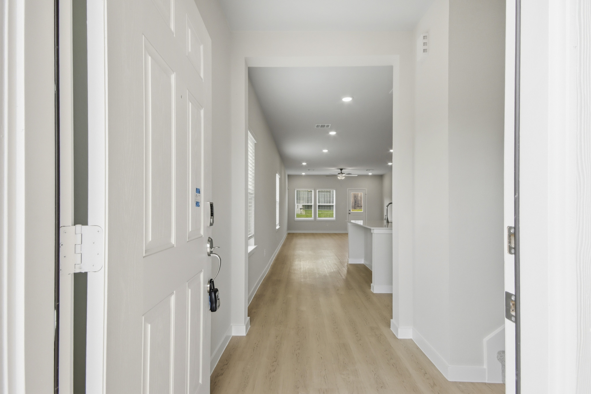 A hallway with white doors.