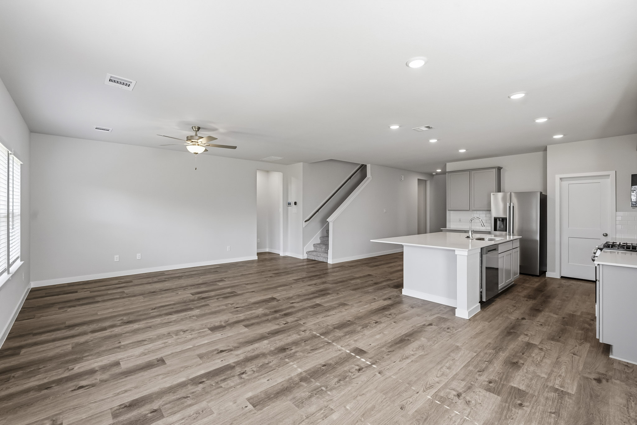 A large kitchen with white cabinets.