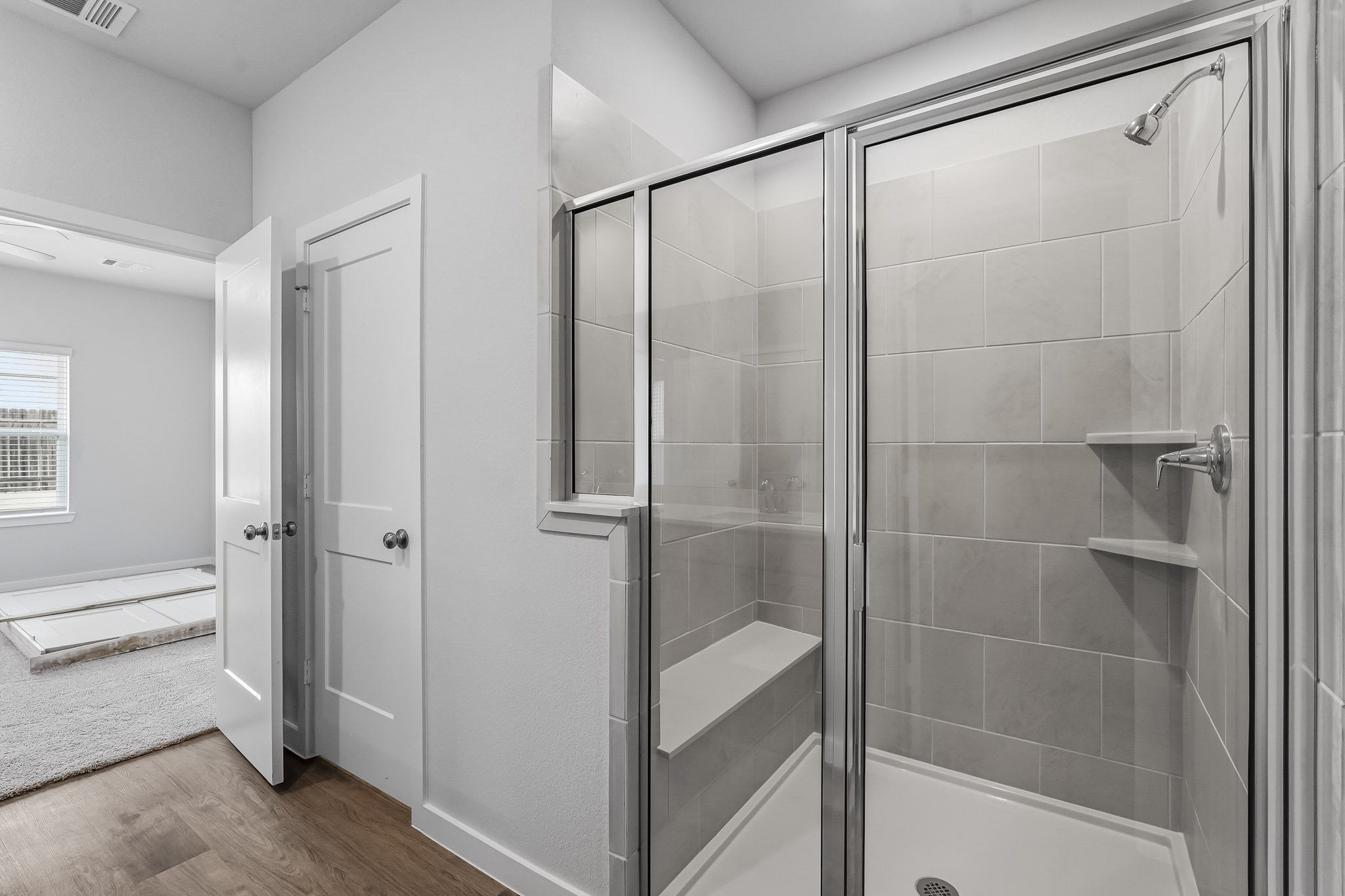 A bathroom with a glass shower.