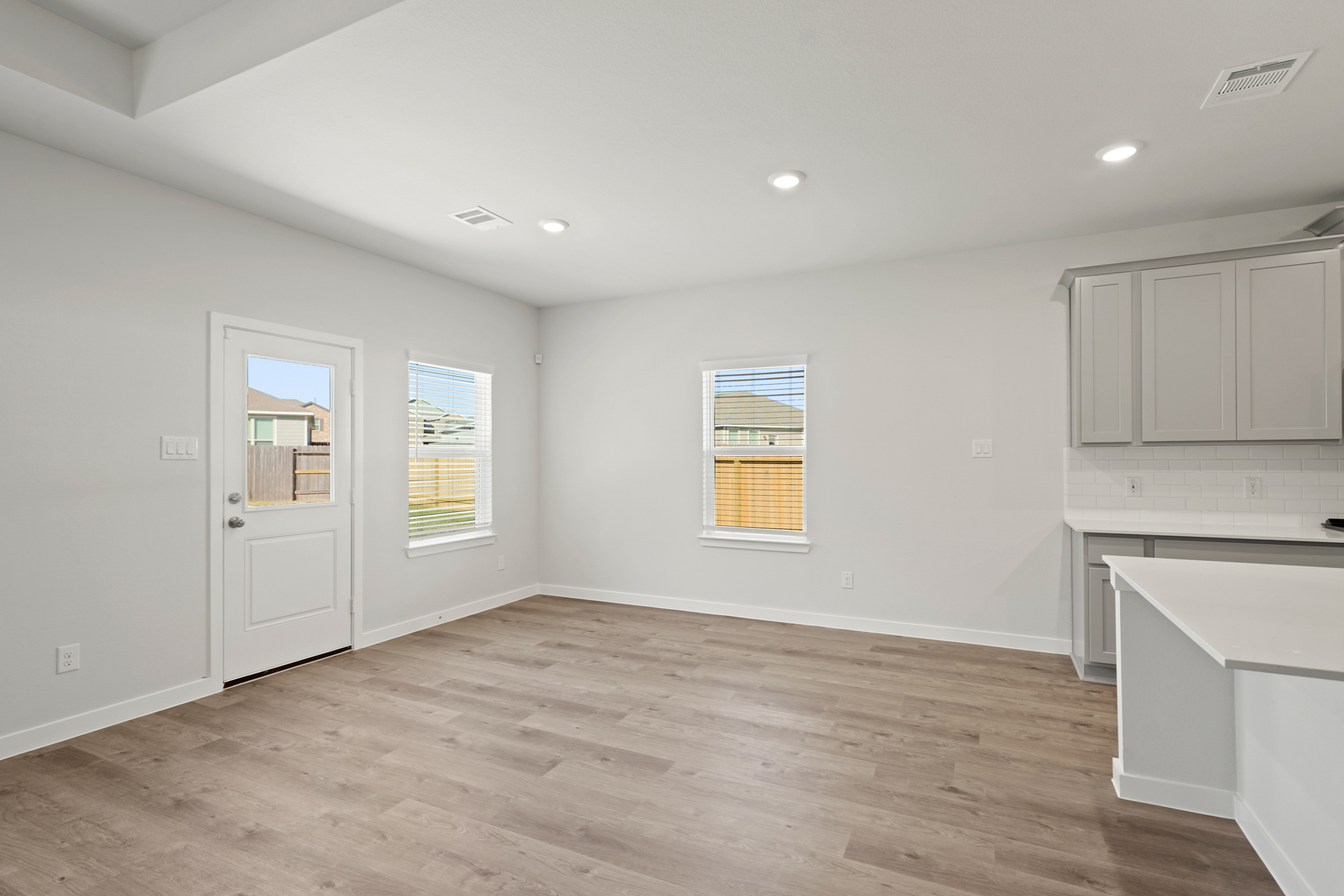 A room with white cabinets.