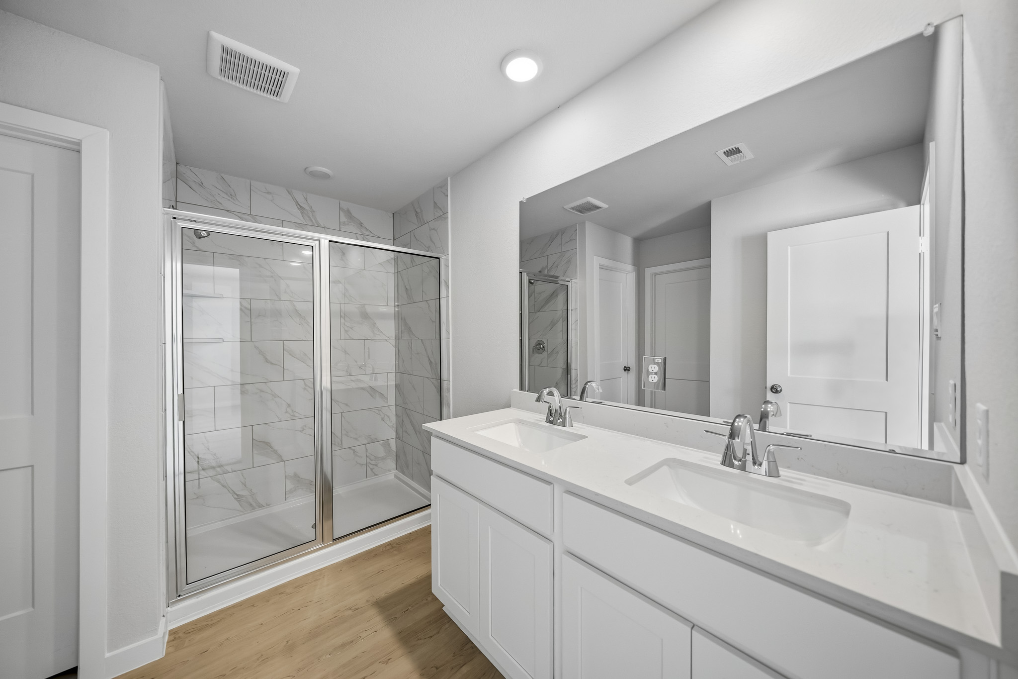 A bathroom with a glass shower.