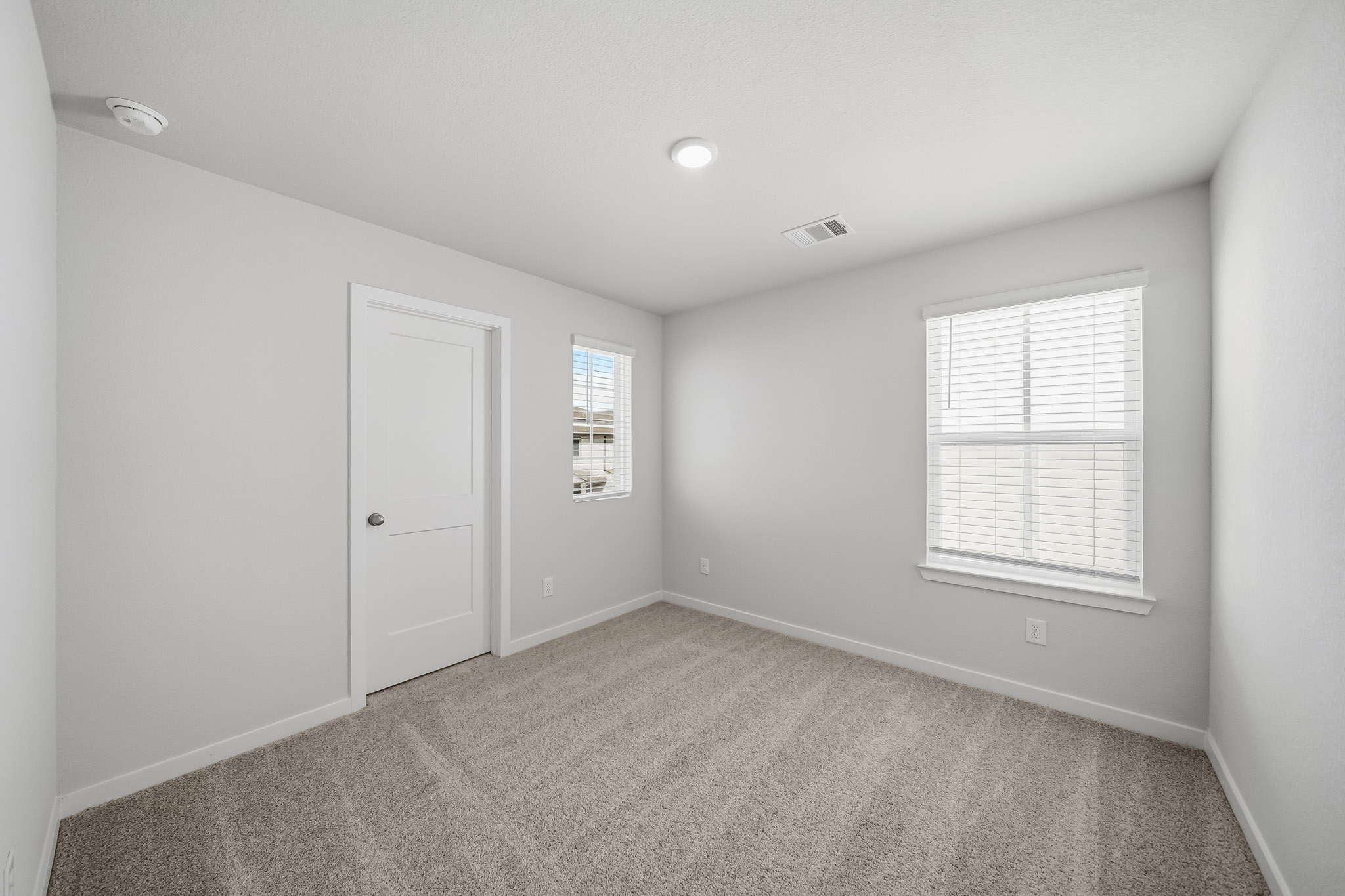 A room with a door and a window.