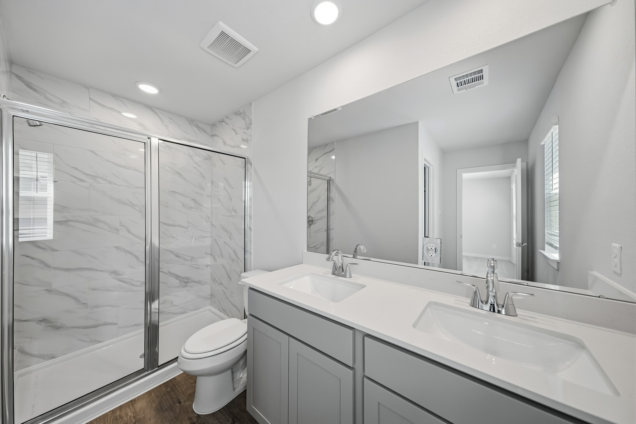 A bathroom with a glass shower.