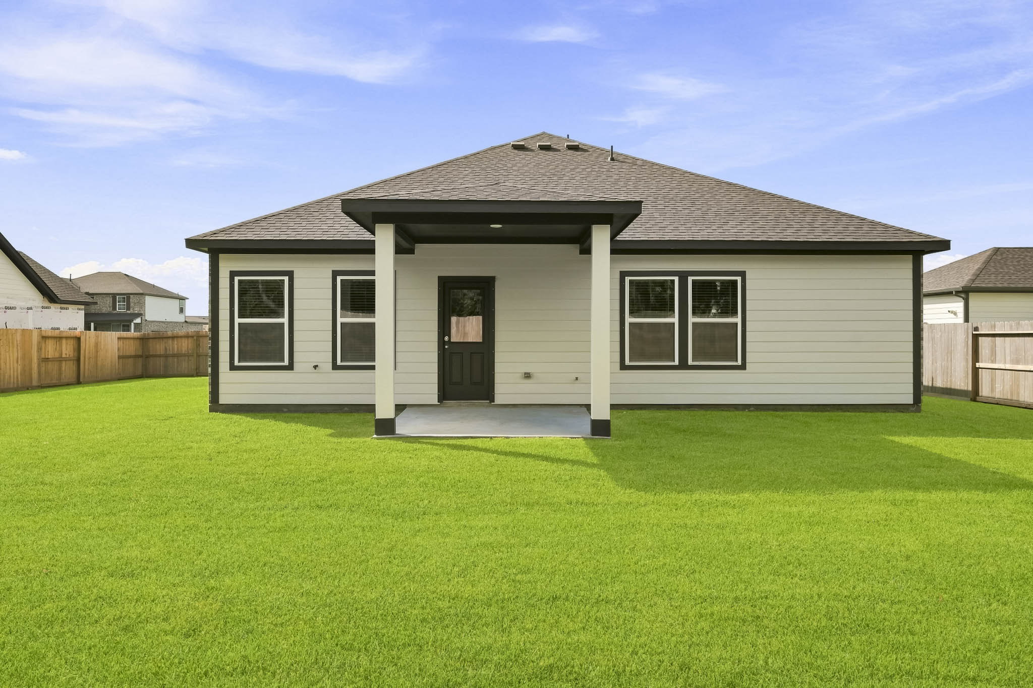 A house with a grass yard.