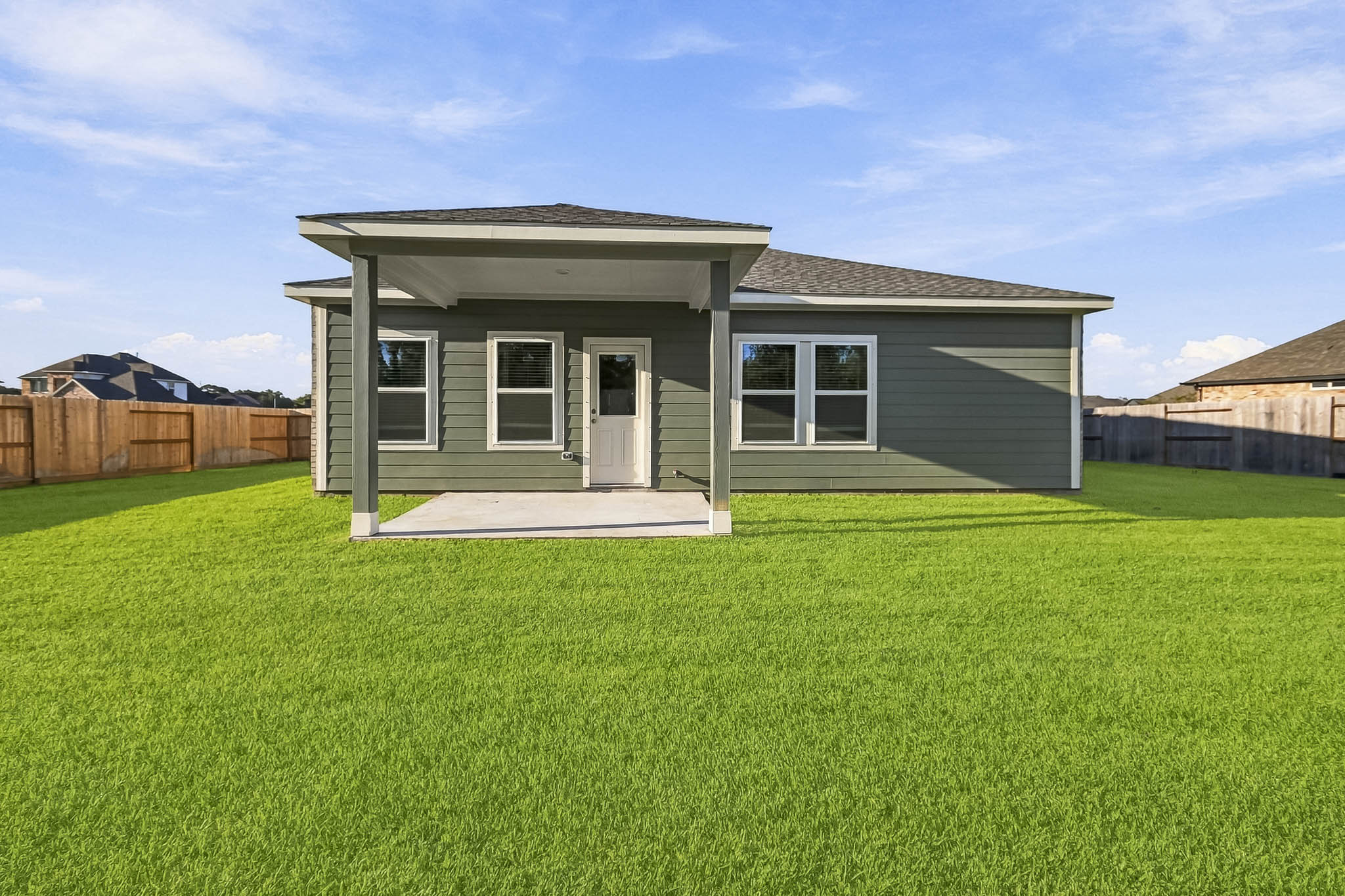 A house with a grass yard.