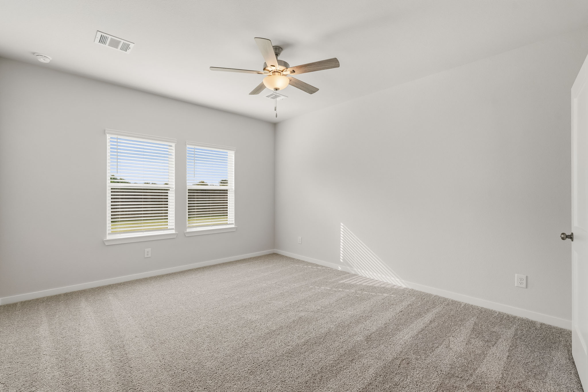 A ceiling fan in a room.
