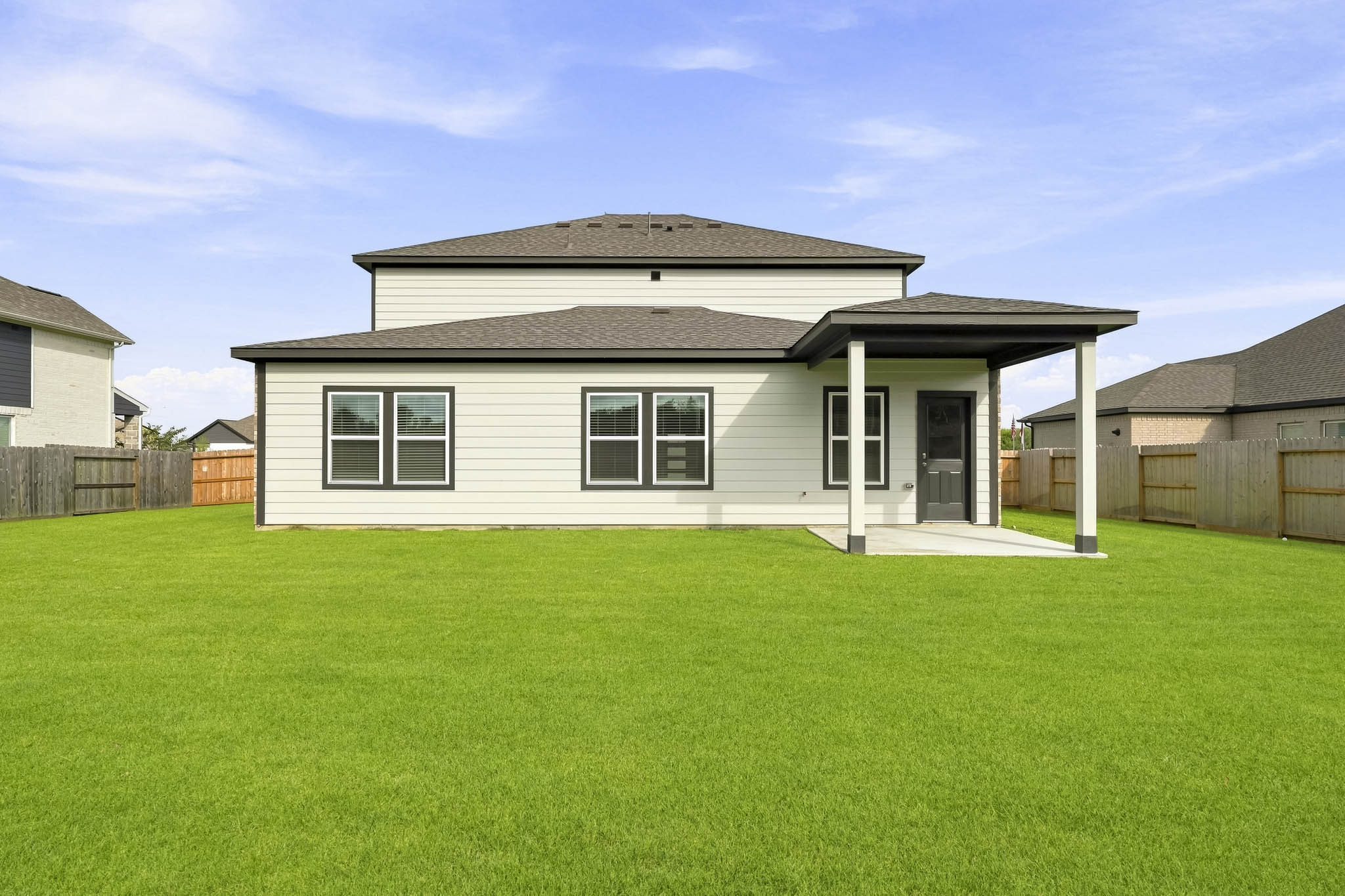 A house with a green lawn.