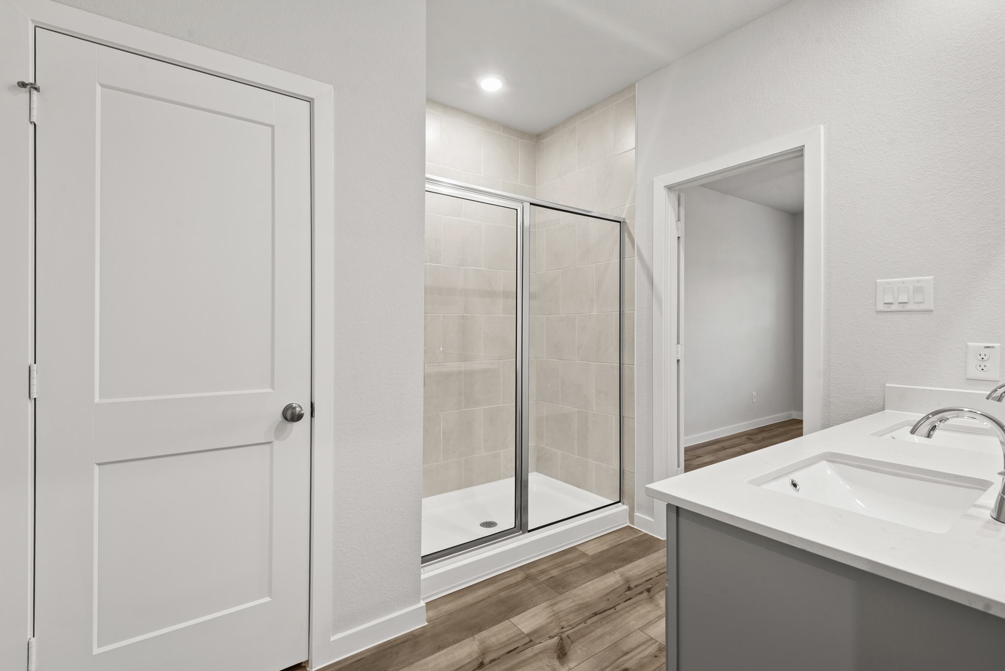 A bathroom with a glass shower.