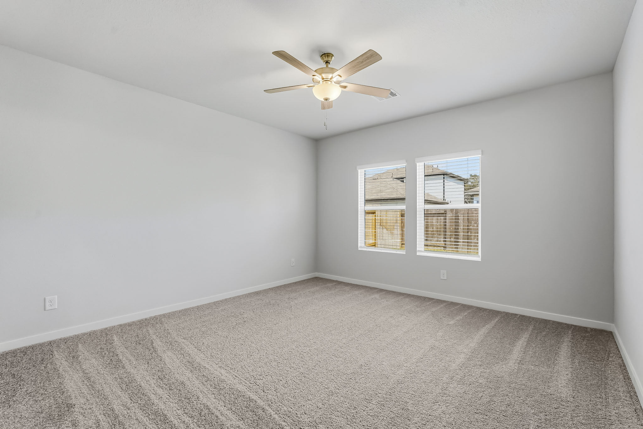 A room with a ceiling fan and a ceiling fan.