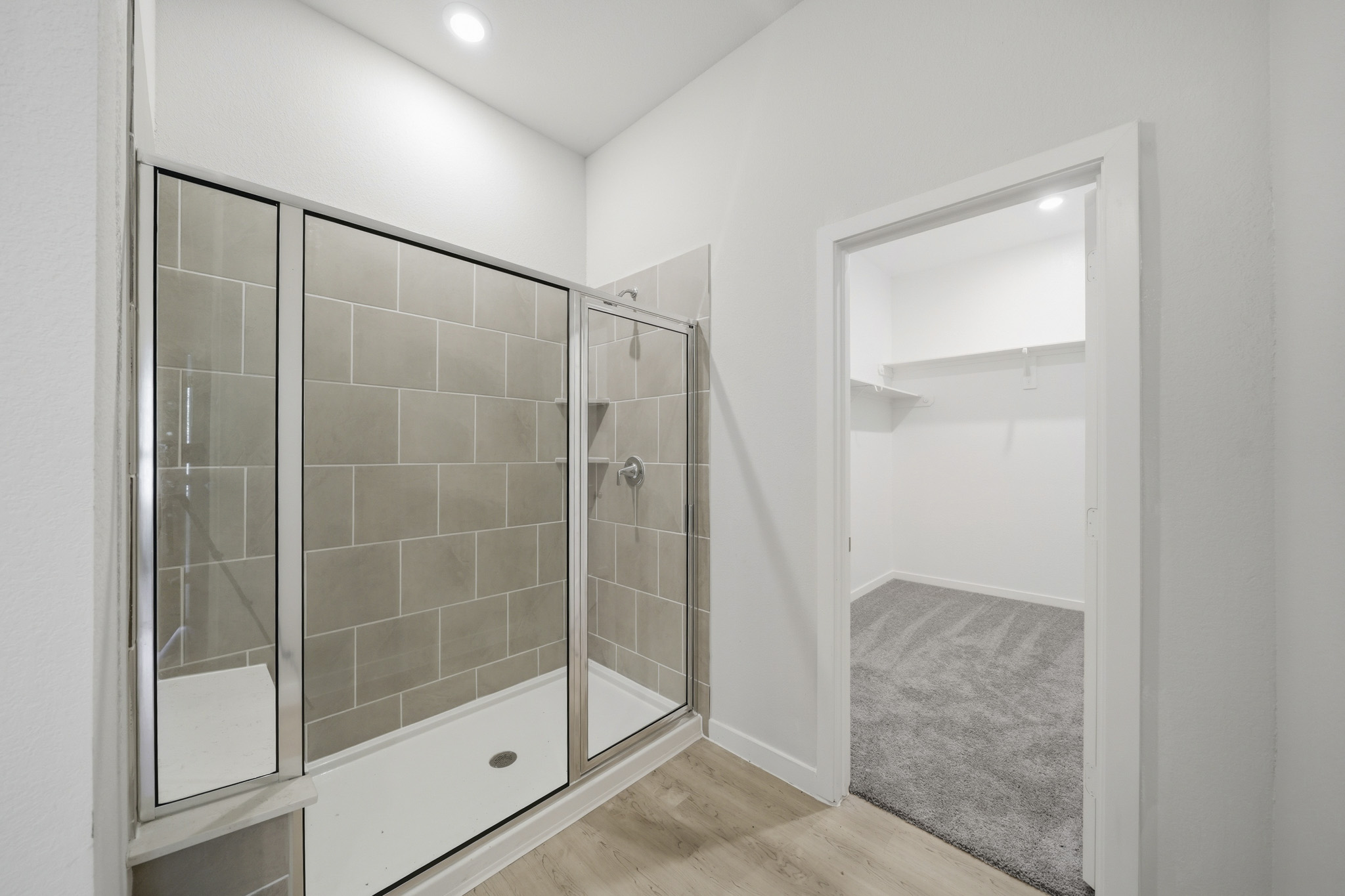 A bathroom with a glass shower.