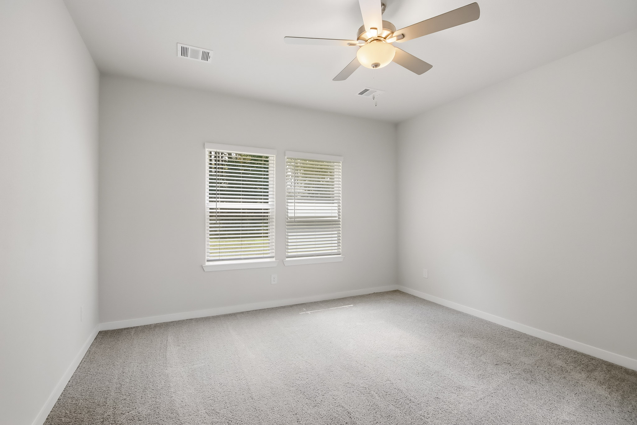 A ceiling fan in a room.