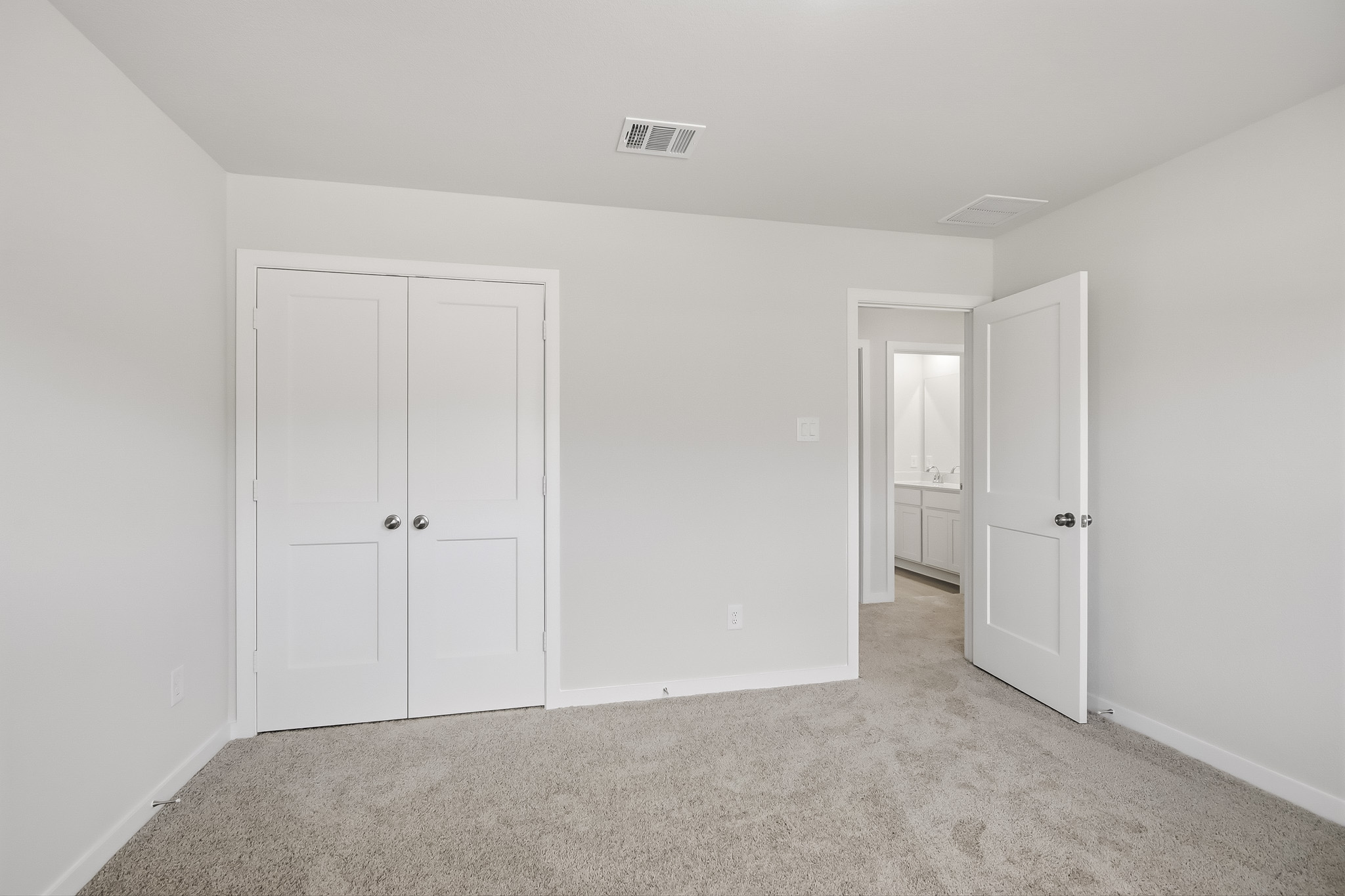 A room with white doors.