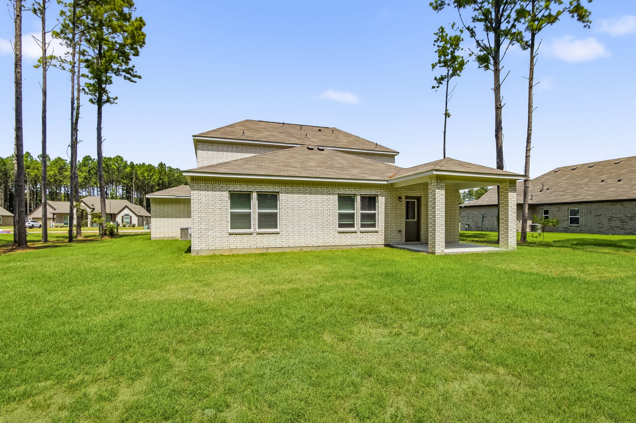 A house with a grass yard.