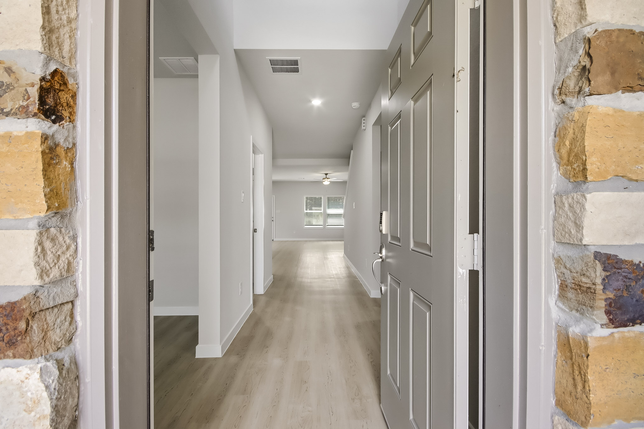 A hallway with white doors.