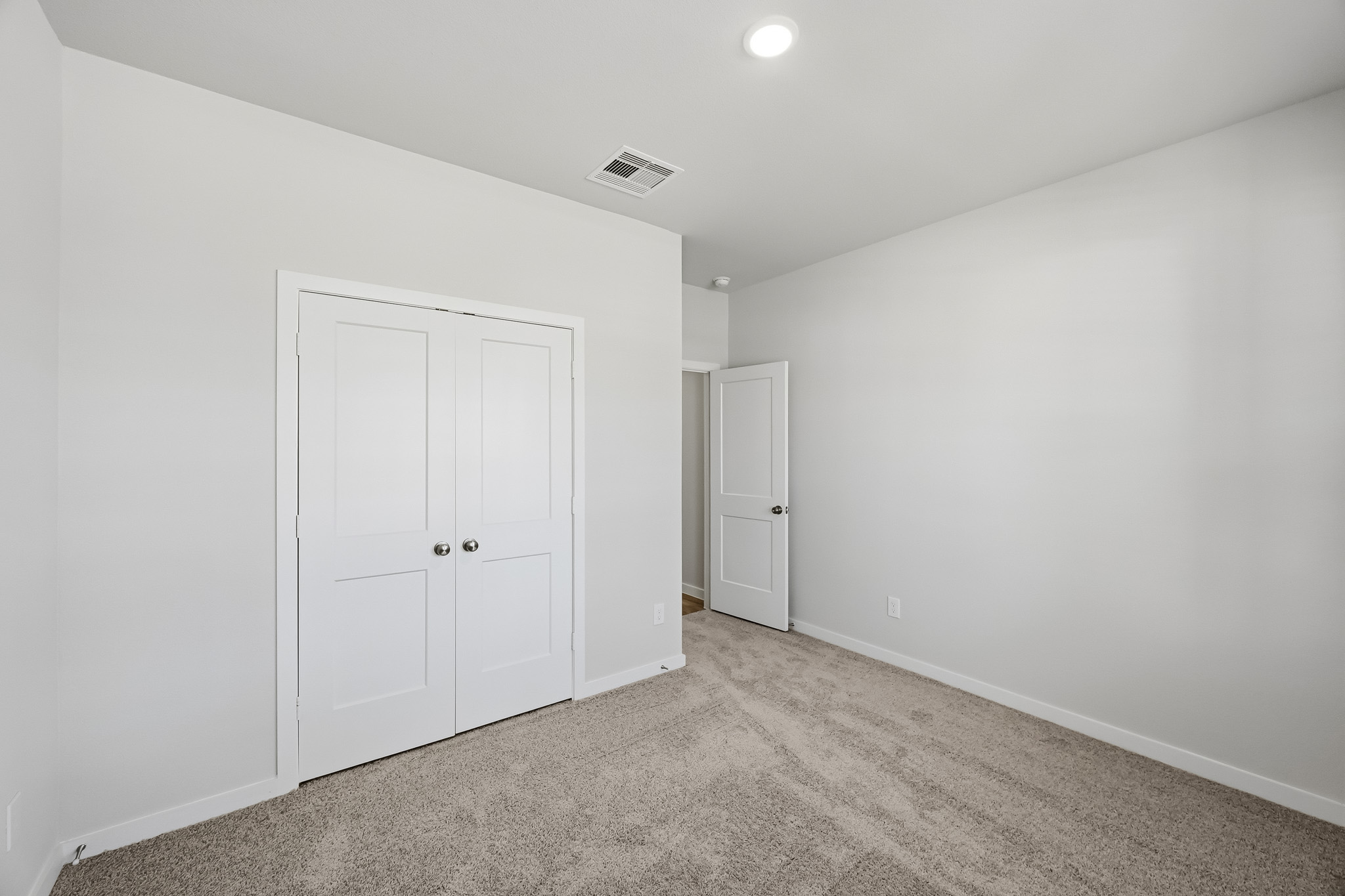 A room with white doors.