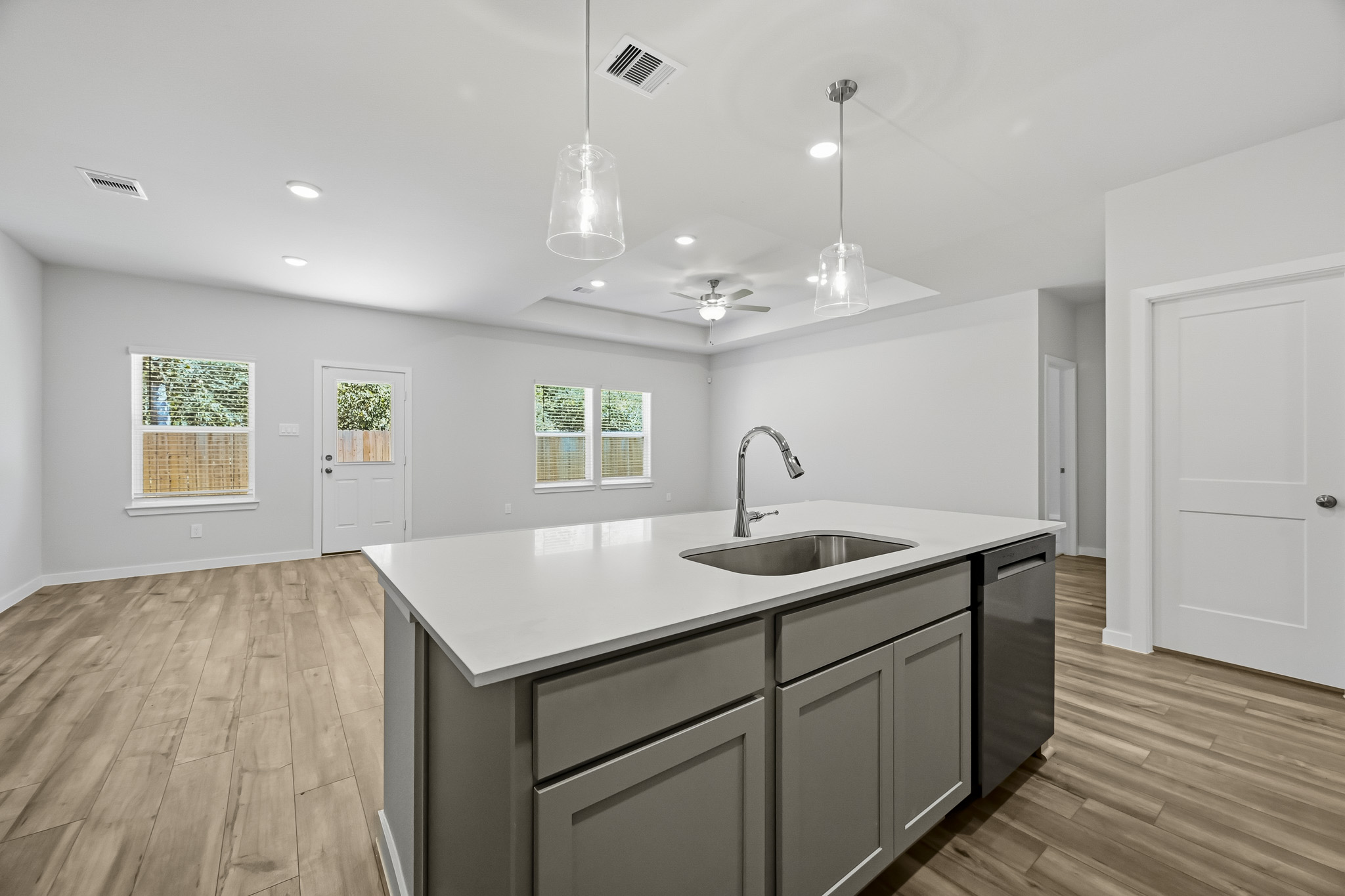 A kitchen with a sink and a countertop.