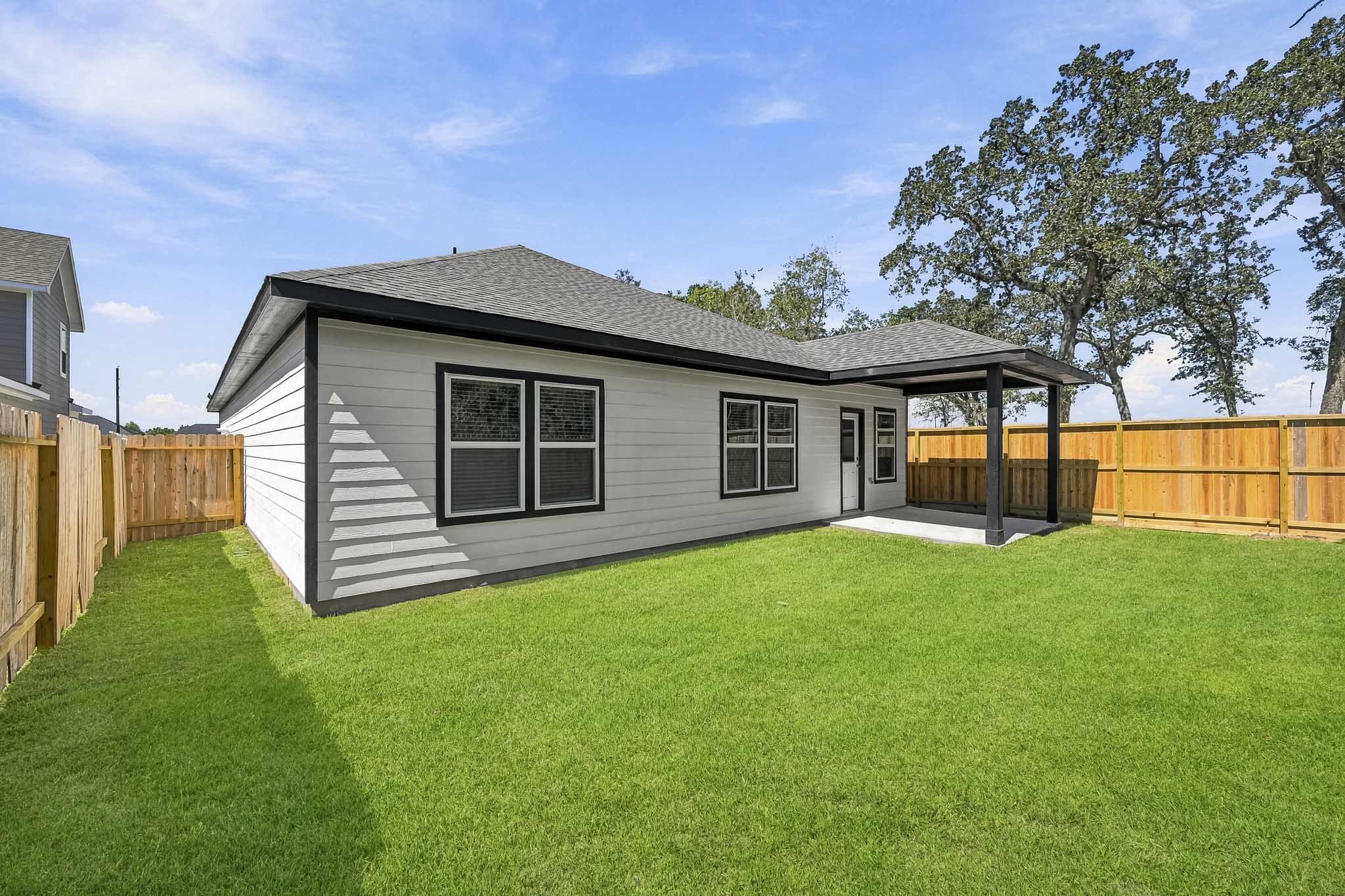 A house with a fence around it.